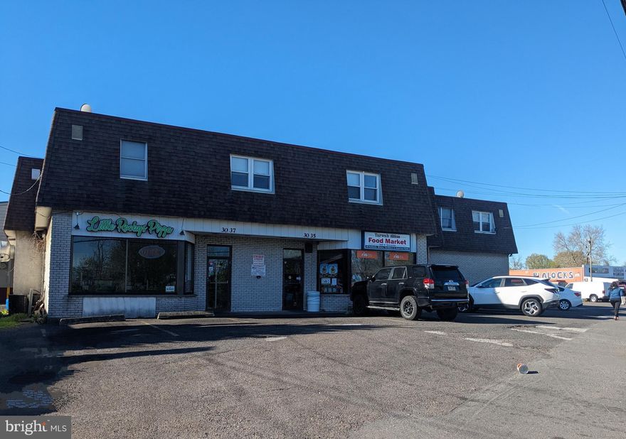 Turnkey Investment Opportunity - This property has two store fronts currenty consisting of a Pizza Place and a Grocery Market.  In addition to the storefronts there are also 3 Second Floor Apartments,  consisting of 2 Two Bedroom Apartments and 1 Three Bedroom Apartment.  These 5 Units are fully leased. Also included is the 2 car garage, which is not currently leased.  This property located on Ford Road convenient to 95 and all main roads.  P lease call agent for further details.