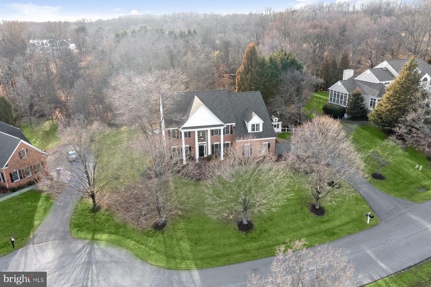 MODELED TO PERFECETION…REIMAGINED in 2022 by owner who wanted build their forever home in one of the most coveted neighborhoods-and every detail shows.  Extraordinary Excellence to detail, this architecturally refined residence reflects a fully custom, professionally executed whole-home renovation encompassing both the interior and exterior. Every space was thoughtfully redesigned as part of one cohesive vision, resulting in a home that feels elevated, intentional, and exceptionally well crafted throughout. Perfectly positioned on a tree-lined cul-de-sac in the highly coveted Kingsbridge community, 10312 Kingsway Court is a rare offering that redefines luxury living in Howard County.  Set on expansive resort-style grounds backing to preserved forest, the property offers remarkable privacy while remaining just minutes from top-rated schools, dining, shopping and everyday conveniences. 

Designed for both elevated entertaining and effortless daily living, the outdoor spaces are truly exceptional. The saltwater pool and spa were renovated and converted in 2022, while a stunning Belgian Orangerie, spacious Trex deck, bespoke Garden House & Art Studio, fenced herb garden, and added mudroom entry further reflect the scope and sophistication of the home’s complete transformation. Extensive exterior upgrades completed in 2022, including the designer roof, HardiPlank siding, bronze gutters, black shutters, and curated architectural details, contribute to the home’s striking presence and custom estate feel. All set on a premium large Cul-de-sac lot backing to THE PRESERVES and offering public water and sewer truly rare in the county. 

Inside, the residence is rich in craftsmanship and design continuity, from hand-sanded oak floors with intricate wood inlays to soaring ceilings, a dramatic Palladian window wall, marble-mosaic fireplace, and custom library shelving. The gourmet kitchen is equally impressive, featuring a two-tier quartz island, marble backsplash, imported Italian tile flooring, Gaggenau steam oven, Bosch 800 appliances, Thermador range, Perrin & Rowe faucet, a designer-crafted butler’s area, café station, and an English-style pantry with refined custom finishes.

Upstairs, the primary suite offers a luxurious sanctuary with a spacious sitting area overlooking the gardens and Orangerie, two custom cedar walk-in closets, and a spa-like bath with a custom steam shower, body sprays, rain showerhead, arched marble niche, freestanding solid copper tub with air jets, fireplace, and solid teak double vanity with marble countertops. The finished lower level continues the home’s versatility with a large rec room, gas fireplace, custom built-ins, exercise room with bar, full bath, and guest quarters. Better than new construction and unlike anything else on the market, 10312 Kingsway Court offers a rare blend of artisan quality, curated luxury, and a truly comprehensive design vision from inside to out.  We are selling lower than the appraised value so HURRY…OPEN 1-3pm Saturday and Sunday 11-3pm.