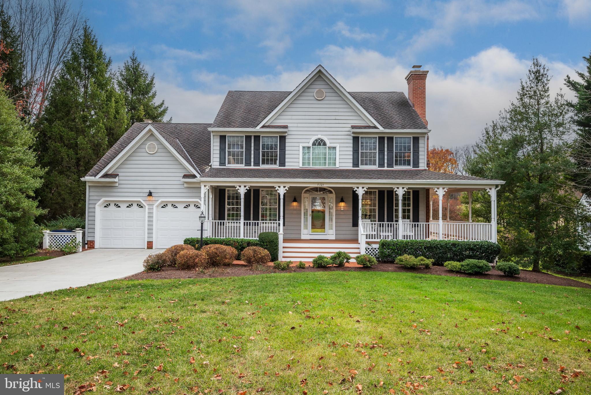 OFFER DEADLINE MONDAY 11/25 @ 5PM. A rare opportunity to own an elegant home in superb condition with extraordinary style yet oh so comfortable. Located on one of the most magnificent lots in all of Columbia with a commanding view of the second hole fairway of Hobbit's Glen golf course on almost a full acre of natural shade trees and manicured lawn. Framed by a coveted very generous covered porch which wraps three sides culminating in a large entertainment platform with vaulted ceiling and 2 fans to always provide a gentle breeze. Welcome to the two-story entry foyer flanked by a formal living room with gas fireplace and built-in shelving, and separate library with built-in desk and shelving made private by French doors. The renovated kitchen will wow the most particular chef. Expertly designed by Stuart Kitchen, embrace the golf course view with wall-to-wall windows and sliding door to the rear observation deck. Solid wood cabinetry with hand washed overlay framed by rope accented crown molding. Ample drawers and cabinetry with pull out shelving, including wine storage. There is a massive island ideal for serving w/space for 3 to be seated in a hidden nook. Monogram and KitchenAid stainless appliances to include built-in refrigerator, 5 burner gas cooktop, dishwasher, built-in double oven and microwave, and warming drawer. Luxurious granite counters. The kitchen joins the formal dining room with large bay windows, Butler's pantry with separate bar sink, breakfast room and family room framing an additional gas fireplace, all with access to the rear porch. Hardwood flooring, generous moldings and attention to detail, including chair rail and framed panels throughout the entire main level.  The upper level will delight all those who favor a primary suite with every luxury; built-in shelving, sitting/dressing room with ample light provided by 2 sky-lights and access to two large walk-in closets, a recently renovated primary bath with two separate vanity stations, free standing tub, over-sized shower, water closet with bidet seating, storage shelving and linen closet. Comfortable wide hall and landing with linen closet, window seat will access 3 other bedrooms all served by a renovated hall bath with separate vanities and interior door to separate tub/shower and toilet with bidet seating and vanity to offer private use of the space for two. Upper baths have quartz vanity counters. The walk-out lower level offers multi-use spaces for entertainment, exercise, formal office/guest space convenient to additional full bath. The laundry/utility room also adds tremendous storage space with shelving that will remain. There is a rear sliding door opening to a fenced patio that can become your English flower or herb garden, or perfect to contain your precious visitors and pets! The over-sized garage, also with ample storage, also provides a newly installed EV charging station. Whether you golf or just enjoy your favorite book or beverage as you over-look the course and pond; or from inside every main level window or lounging outside, there is peace on the porch! Convenient to shopping, commuting, minutes to the Turn House dining and all amenities that Columbia can offer, you will be thrilled to call this beautifully maintained and improved property your next home. HOA is CA.