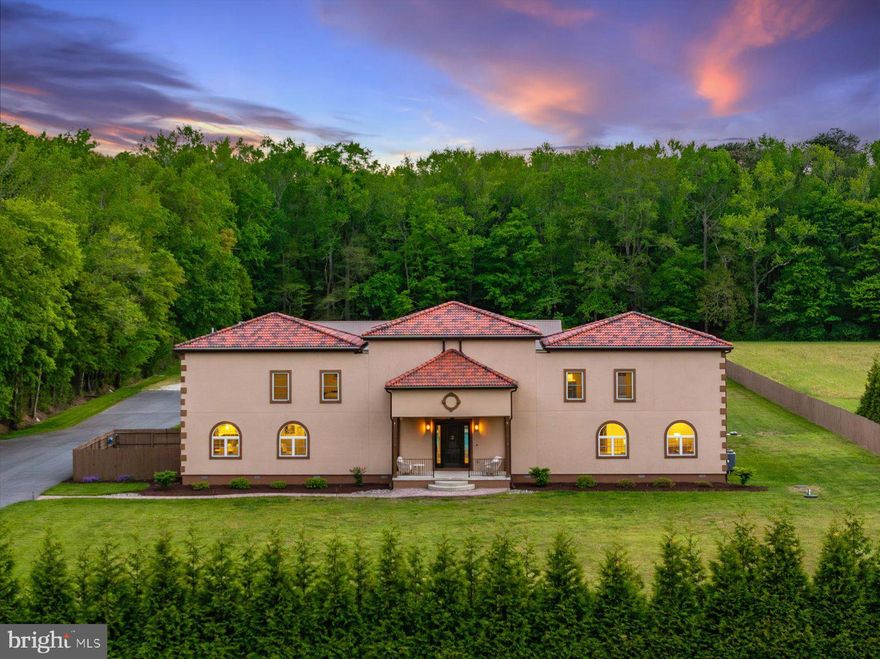Property Overview: Residence: 6,800 SF  |  3-Car Garage: 1,200 SF  |  Warehouse/Flex Building: 3,100 SF
Pool Deck: 3,500 SF.............Set across 18+ private acres in Bishopville, this estate is a study in scale, discretion, and purposeful design—an offering rarely seen this close to Ocean City and the Delaware coastline. The residence spans 6,800 square feet of curated living space, where proportion and restraint define the experience. Elevated ceiling heights, clean architectural lines, and a cohesive material palette create an environment that feels both expansive and composed. At its center, the kitchen is executed with precision—Silestone quartz surfaces, custom Wolf cabinetry, and a substantial island designed for both function and gathering. Every element has been selected for performance, longevity, and understated elegance. The home unfolds into a series of well-scaled living and entertaining spaces. The primary suite is quietly refined, offering tailored storage and a sense of retreat. Throughout, the emphasis is on livability without compromise. Beyond the residence, a 3,100-square-foot warehouse/flex structure introduces a level of versatility seldom found in residential offerings. With separate access, dedicated utilities, and a blend of finished and open space, it accommodates everything from a private studio or executive workspace to collector-grade storage. Outdoors, the estate transitions seamlessly into a resort-caliber setting. A heated saltwater pool is framed by an expansive 3,500-square-foot deck, complemented by a fully integrated outdoor kitchen and fire feature—designed for effortless entertaining and quiet evenings alike. Infrastructure is equally considered. Enhanced electrical capacity, specialized equipment readiness, and engineered drainage systems ensure the property performs at the highest level behind the scenes.
Clad in timeless, low-maintenance materials—including stucco/EIFS, Andersen windows, and a blend of standing seam metal and composite barrel tile roofing—the exterior reflects the same commitment to longevity and design integrity. This is not simply a residence—it is a private compound offering scale, flexibility, and proximity to the coast, without sacrificing privacy or control.