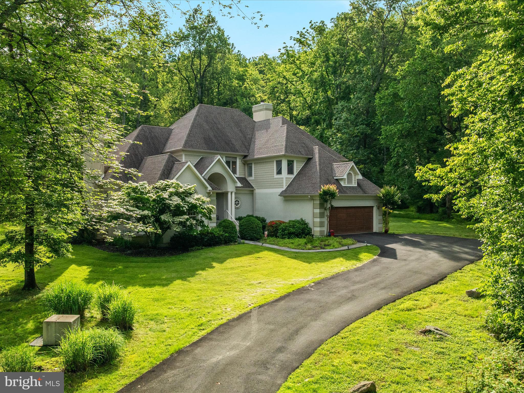 Breathtakingly beautiful custom estate home on over 10 stunning open and wooded mixed acres. Incredible ATV trails through woods! Brand New $45k hip roof. Inviting portico elevation with architectural flair and detail everywhere. Simply spectacular. Shaker siding and stucco exterior. Grand and open foyer leading to sunken living room with gas fireplace, tall windows and architectural details. Main level office/sunroom/main level bedroom off living room with private entrance and walls of windows. Gorgeous dining room with floor to ceiling windows, stepped ceiling and open to kitchen. Beautiful kitchen with maple cabinets, breakfast bar, stainless steel appliances, gas cooktop, refrigerator with drink drawer, built ins, desk, wine racks, huge corner pantry, and kitchen sink overlooking backyard. Second dining area off kitchen with wall of windows and leading to impressive screened in porch. Enormous family room off kitchen with incredible wood burning fireplace. Fabulous and huge laundry room on main level with raised LG washer and dryer, mud sink, and cabinets everywhere. Full bathroom on main level. Upstairs you will find more custom beauty, trimwork and detail. Huge landing leads to massive primary suite with sitting room, double walk in closets, private deck and primary bathroom with jetted tub and separate shower. Two additional upstairs bedrooms both large in size and secondary hall bathroom. Bumpouts, closets, storage and architectural detail everywhere. HVAC 2020. Custom high end "Peachtree" windows throughout home. Stunning garage with skylights and storage. Two ATV trails throughout lot leading to local Brewery (Old 690 Brewery) and Walsh Family Winery! Driveway privately owned. Spectacular move in ready home with all the bells and whistles.