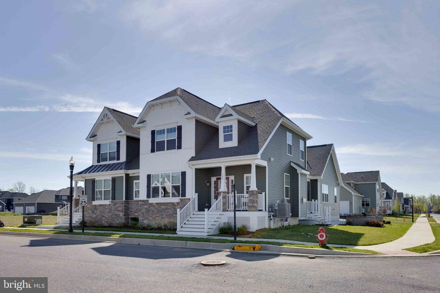 Now "Best Value" in Heritage Creek! This beautifully appointed home is packed with thoughtful upgrades, creating a fantastic opportunity to make it your own. Bright, airy, and move‑in ready, this 3‑bedroom, 2.5‑bath, three‑story carriage home—built in 2024—offers the perfect blend of comfort, style, and convenience.

Step inside to an open floor plan featuring luxury plank flooring throughout the main level, vaulted ceilings, and an abundance of natural light. The upgraded kitchen shines with oversized quartz counters and enhanced cabinetry, while both bathrooms feature ceramic tile flooring for a polished, modern feel. A traditional gas fireplace with mantel adds warmth and charm to the living area.

Enjoy indoor‑outdoor living with an inviting screened porch that leads to a spacious stone patio, ideal for relaxing or entertaining. The oak staircase, upgraded with LVP treads and open spindles, adds a custom touch that continues to the loft area. The home also includes whole‑house window treatments, crown molding on the first floor, ceiling fans, upgraded lighting, and a storm door plus retractable screen door to the garage.

A full unfinished basement with plumbing rough‑in offers endless possibilities—create a recreation room, home office, or additional living space whenever you’re ready. The home is also equipped with Energy Star–certified appliances, including the refrigerator, washer, and front‑load dryer, and has been freshly painted in custom designer colors. An irrigation system adds ease to outdoor maintenance, and the HOA includes full lawn care.

Located in the desirable Heritage Creek community, this Hancock model enjoys a peaceful setting overlooking the open fields of the nearby middle school—perfect for taking in unobstructed year‑round sunsets right from your patio. The community offers amenities for all ages, including a modern clubhouse with fitness center and lending library, a seasonal outdoor pool, a playground, and beautifully maintained grounds.

Just minutes from the historic charm of downtown Milton and a short drive to the Delaware beaches, this home delivers exceptional value, top‑notch upgrades, and a convenient location—all without the wait of new construction.

A fabulous opportunity at an incredible price to enjoy the lifestyle you’ve been looking for.