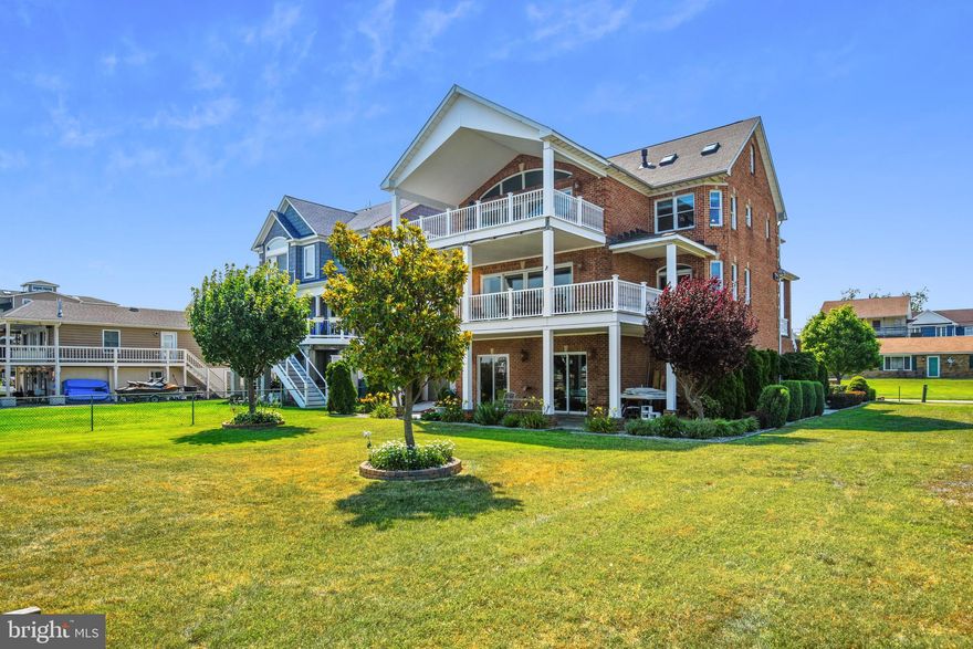 Waterfront home on the Chesapeake Bay (Millers Island)  construction is ALL brick  and all masonry steps  the home is over 4000 sq ft.  with a view of Rock Hall, Md.  200ft pier with 50ft bulkhead.  Ground floor garage with heated floor  plus 3 floors of living space.   Two decks totaling over 700 sf   Stamped concrete patio 400 sf. & sidewalks. Three zoned HVAC with new high efficiency units (2yr warranty).  Energy efficient , back up hydroponic heating system with on demand hot water. Two propane fireplaces three siding serving first floor and  two side serving master bedroom and master bathroom. Three full and one half baths. Plumbing in place for two future baths 
 Third floor could be used as additional bedrooms, in-law suite, recreational room or home offices. 
. Two propane fireplaces; three sided model serving first floor & two sided model serving master bedroom & bathroom.  Four level elevator will take you to the top of your world. Three full & one half baths. Plumbing in place for two future baths. Stainless steel, Kitchen  Aid appliances including two ovens. Cori-an counter tops. Maple kitchen cabinets (42 inch) with cherry trim. Custom hardwood flooring. Marble flooring in bathrooms. Open floor plan with oversized rooms. Custom built-in entertainment system. Ceiling fans, recessed lighting & crown molding throughout. Motorized curtain rods on sliding doors (16ft) in family room & master bedroom. Four motorized skylights. Oversized (6ft heated) Jacuzzi Whirlpool tub. Oversized free span (no lolly column) garage with 8x10.5 ft. garage doors. 400 amp electrical service. Wet bar in family room & master bedroom. Home warranty offered. You must set an appointment to see this Magnificent HOME ! The workmanship is total perfection. Call now.