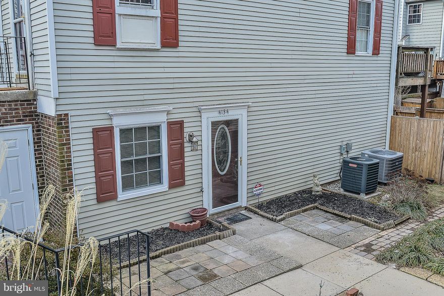 Priced to sell! Charming condo on a patio level with private side entry.  Open floor plan, living room has a cozy wood burning fireplace, kitchen with table space, dual entry bathroom with laundry room attached.   Beautiful flower gardens and  gorgeous slate patio. Close to RT 28, 50 Dulles Airport, shops. restaurants, pools, tot lots and so much more!