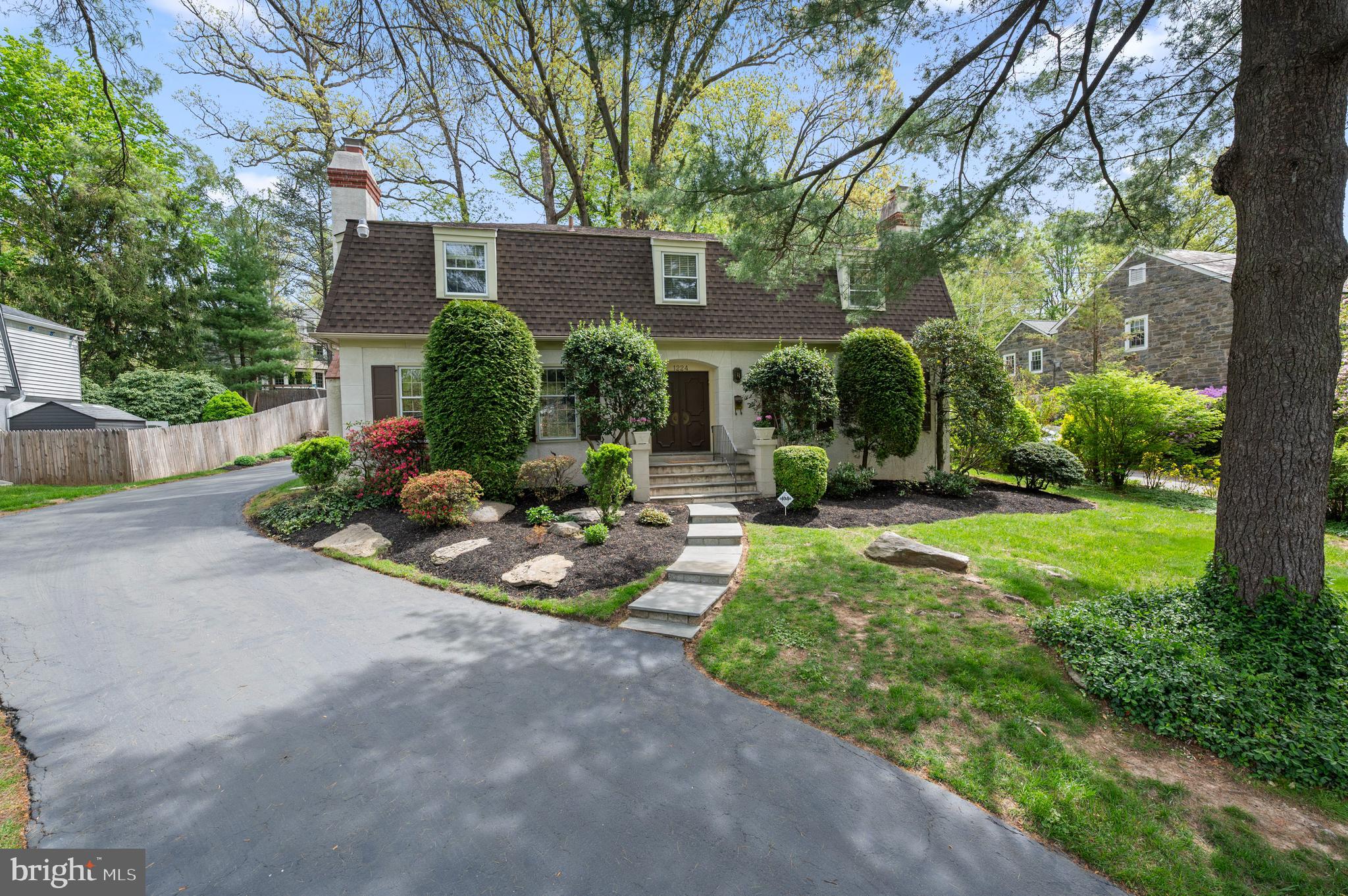 5/3 OPEN HOUSE IS CANCELLED - WE ARE UNDER CONTRACT. Set in one of the Main Line’s most coveted neighborhoods, this French Colonial-style home exudes timeless charm with modern amenities. Located in the award-winning Lower Merion School District, this property is just a short walk to South Ardmore Park, Whole Foods, and offers easy access to Suburban Square, the 44 SEPTA line, regional rail, and Amtrak, making it the perfect blend of convenience and comfort. Step inside to discover the grandeur of a 2-story foyer with a turned stair flanked by both formal living and dining rooms with original hardwood floors, wood burning fireplaces, built-in cabinetry and oversized windows. The heart of the home includes a large eat-in kitchen, featuring granite countertops, stainless steel appliances, and plenty of cabinet space, along with a cozy den and sun-filled family room addition - ideal for cooking, dining, and entertaining. Both the kitchen and family room open onto a bluestone and brick terrace with a private back yard – the perfect setting for outdoor gatherings and quiet enjoyment alike. Upstairs, the large primary suite addition is a true retreat with walk-in closets and a luxurious en-suite bath. Three additional generously sized bedrooms and 2 full bathrooms offer ample space for family or guests. The finished basement provides even more living space, and storage (including space for a home gym!), while the home’s newer roof (2021), backup generator (most major systems), and detached two-car garage add modern touches for peace of mind. This stunning French Colonial offers elegance, comfort, and convenience—all within walking distance to parks, shops, and transportation. 1224 Knox Road is the forever home you’ve been waiting for - a rare find in a truly desirable location!