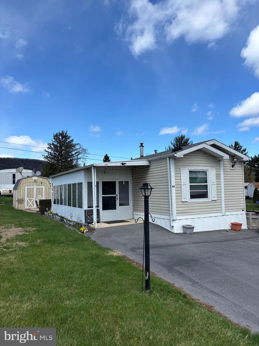 Affordable and easy living await at 97 Birch Street in Continental Courts, located in the peaceful countryside of Bellefonte. This charming 2 bedroom, 2 bath home features vaulted ceilings, a screened-in porch, off-street parking for 3 vehicles, outdoor patio space, and a shed. With low-maintenance living, this home offers comfort and convenience off of Route 550; 10 minutes from Bellefonte, State College, Penn State, Beaver Stadium, and I-99 so much more! Lot rent is $345 per month and includes sewer, common area, and road maintenance. Don’t miss this opportunity!