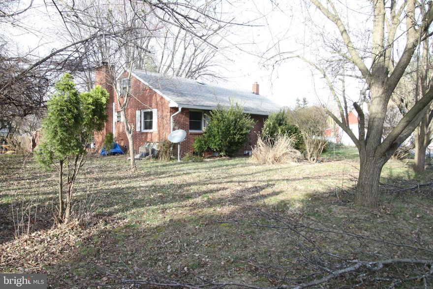 Investor opportunity with significant upside potential. Situated on approximately 1.66 acres, this property includes two dwellings—a main brick ranch home and a separate 2-bedroom bungalow with attached garage. Both structures require major rehabilitation and are being sold strictly as-is. The main home offers a traditional ranch layout with a basement, while the secondary dwelling provides additional value for renovation, rental income, or multi-use potential. Due to the condition of the property, access is limited, and a signed release is required before entry. Cash or renovation financing recommended. Ideal for investors, contractors, or buyers seeking a project with land and dual-structure potential.