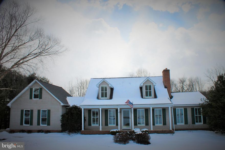 Charming!  Classic custom built Cape Cod 4 bedroom, 3.5 bath, 2 car garage with an open floor plan.  So many appealing qualities in this delightful home: natural light, hardwood floors, granite counter tops, SS appliances, built in bookcases, wainscoting and to add to the ambiance custom plantation shutters and a wood burning fireplace in the family room.  First floor Master Bedroom and en suite with soaking tub. Relaxing outdoor spaces on this 2.88 acres with a covered front porch and a great expansive flat backyard with a deck and pergola for all your entertaining desires.  The lower level has two large finished rooms and also has plenty of storage space.  This beautiful home is move in ready.  New Roof 2019, new HWH 2019.