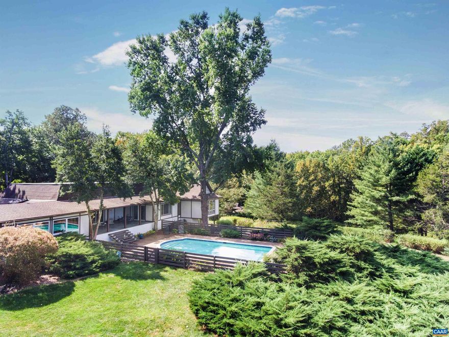 Tranquility, privacy and Blue Ridge views only minutes from Charlottesville.  This light-filled contemporary home opens up to a large bluestone covered patio and swimming pool framed by dramatic mountain views.  The elegant design brings the outdoors into the well proportioned rooms including the kitchen-family combination, beautiful master suite with 5th bedroom/office and in-law suite.  Beautifully maintained grounds surround the home creating a private tranquil setting.  Attractive "Tea House" outbuilding has potential as a studio/useful space. Additional amenities include the swimming pool, two-car garage, generator, second laundry on 1st floor and an au pair suite.  Additional 3-acre parcel available.,Solid Surface Counter,Wood Cabinets,Fireplace in Family Room,Fireplace in Living Room