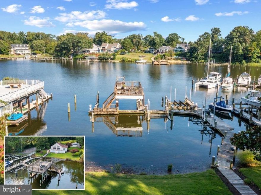Welcome to 25 Leeland Road, an exceptional opportunity to step directly into the waterfront lifestyle on protected Warehouse Creek, which flows seamlessly into the South River and out to the Chesapeake Bay. The property features an enviable private pier with an expansive boat house with a roof deck, multiple slips, an 8,000 lb boat lift, a 20,000 lb boat lift, and two 1,500 lb PWC lifts, making it perfectly suited for boaters of all kinds.

This updated 3 bedroom, 3 bath home offers one level living and an open concept layout, complemented by extensive structural as well as mechanical and aesthetic improvements. Soaring ceilings in both the family room and the primary bedroom beautifully frame serene waterfront views, while the spacious eat-in kitchen with island and two ensuite bedrooms, including one with a private entrance, provide flexibility for hosting guests, multigenerational living, or creating a dedicated office space.

After a day on the water, gather on the expansive rear deck for a crab feast or enjoy panoramic evening views from the coveted rooftop deck over the pier. Interior updates include new Hunter Douglas blinds, custom built-ins in the office and entertainment area, updated faucets, new light fixtures, and newly installed ceiling fans. Significant behind-the-scenes enhancements include reinforced basement supports with new and rebuilt piers, updated bracing, a new sump pump, septic improvements with a new clean out and riser, and a raised well cap. HVAC updates include replaced ductwork and upgraded components for improved airflow and efficiency.

The detached, conditioned oversized garage is another standout feature. It has been fully repainted and is heated, cooled, and outfitted with recessed lighting, ceiling fans, and a powder room. This flexible space is ideal for a workshop, art studio, gym, or additional creative use. The property also includes a newly constructed carport, replaced fencing along the south property line, improved stone landscaping around the pond, and completed permitting for non-conforming use for the boat house, storage, and rooftop deck, permits for dock replacement in kind, and the waterfront shoreline.

Ideally positioned, this home offers quick boating access to the South River and Chesapeake Bay while also providing effortless proximity by car to Historic Annapolis. Located near key corridors including Rt. 2 and Rt. 50, 25 Leeland Road allows for quick access to Washington, D.C. and Baltimore. Whether heading into the cities, catching a flight, or commuting daily, this central Edgewater location makes travel simple while still allowing you to return home to peaceful waterfront living. Welcome home to your relaxed and comfortable waterfront lifestyle!