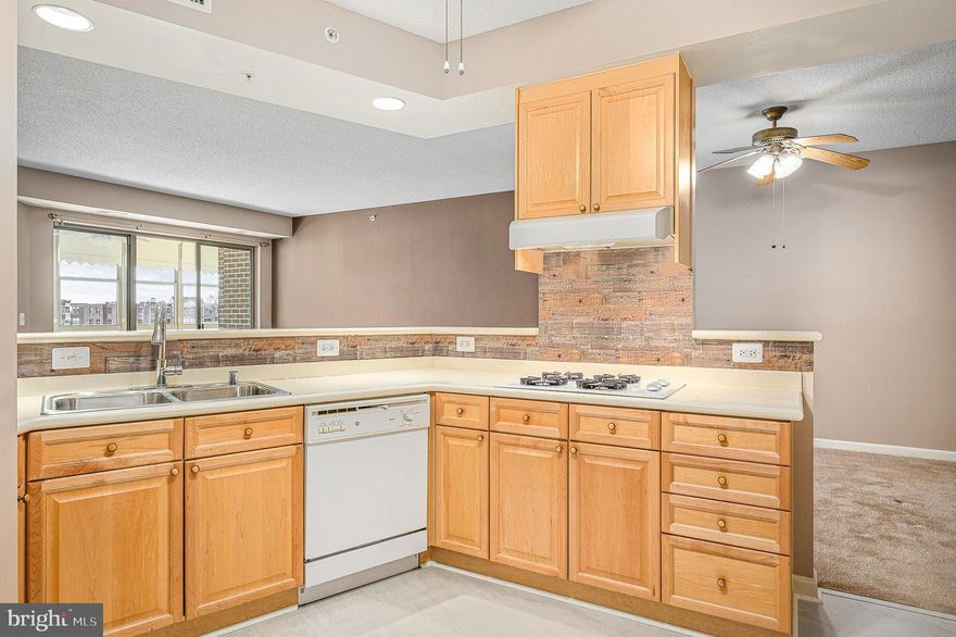 PRICE IMPROVEMENT! BACK ON THE MARKET DUE TO BUYER'S HOME CONTINGENCY FELL APART.  Condo INCLUDES garage space! Welcome to the epitome of 55+ living in Lansdowne Woods! This exquisite 2-bedroom, 2-bathroom condo is a haven of comfort and style. Boasting an open concept kitchen, a glass-enclosed balcony, and an indoor parking space (#4-20), this residence seamlessly combines modern luxury with the ease of carefree living.

As you step inside, the open kitchen invites you to indulge your culinary passion while seamlessly connecting with the spacious living and dining areas. The glass-enclosed balcony offers a perfect spot to savor your morning coffee or unwind in the evenings, providing a picturesque view of the surroundings.

The primary suite is a retreat of its own, featuring a well-appointed private bathroom and ample closet space. The second bedroom provides flexibility for guests, an office, or hobbies, ensuring you have the space you need for your unique lifestyle.

Living in Lansdowne Woods means enjoying a vibrant community with a plethora of amenities. Dive into the refreshing pool, stay active on the tennis courts, or explore the scenic walking trails. The fitness center is perfect for maintaining a healthy lifestyle, and the clubhouse offers a variety of clubs and activities for socializing and entertainment.

Don't miss the opportunity to make this Lansdowne Woods condo your new home. Embrace a lifestyle where every day feels like a vacation!