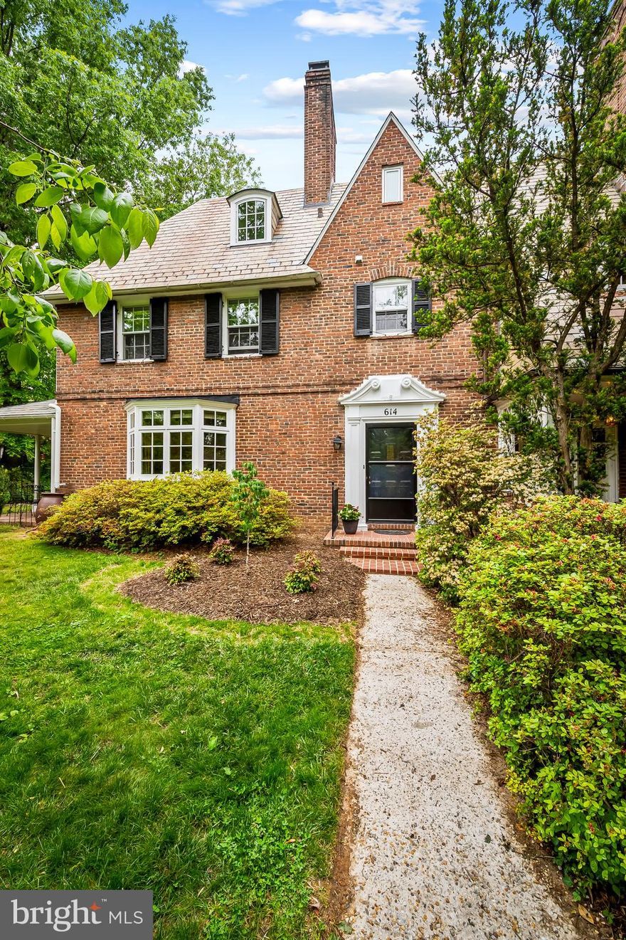 Beyond the gracious foyer, this classic brick semi-detached home blends timeless character with generous living space and beautiful outdoor surroundings. The traditional floor plan features four bedrooms, two full baths, and one half bath, with hardwood floors throughout adding warmth and continuity to every level.

The roomy living room features a gas fireplace, bay window and French doors to the covered porch and is adjacent to a dining room spacious enough to entertain a large group.    The kitchen has natural gas cooking, granite countertops, table space and access to the backyard. 

The 2nd floor feature 3 bedrooms and a full hall bath while the third floor presents an exceptional opportunity for a private primary suite, complete with space for a home office and dedicated bath.
Outside, the mature garden is a private retreat, framed by established trees and thoughtfully planted perennial beds that provide year-round beauty.   There is a large, flat side yard, covered terra cotta-floored porch and brick patio to satisfy all your recreation needs.  Street parking is readily avaialable but there is also a parking pad at the back of the yard for added convenience. 
Located within easy walking distance of Centennial Park, The Rotunda, Johns Hopkins University and Cold Spring Lane restaurants and only 15 minutes to downtown Baltimore, this location is tough to beat. Rich in charm and functionality, this Roland Park residence offers classic architecture, flexible living space, and a serene garden setting in one of Baltimore’s most beloved neighborhoods.