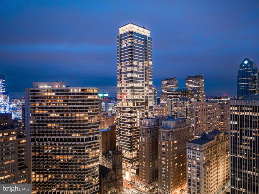 Introducing The Laurel, Philadelphia's newest luxury Condominium and the final residential opportunity on historic Rittenhouse Square. The striking glass tower soaring 48 stories is a masterpiece of contemporary architecture designed to inspire. The Laurel offers quarter floor Sky residences, half floor Estates and full-floor customizable Penthouses.  Come home to one of the most spectacular sunsets the city can offer through the floor to ceiling windows.  The corner balcony allows for a dynamic experience of views from north, west and south giving this home optimal light exposure.  The Euro-style kitchen showcases a stunning high gloss Polar White and Carbon cabinetry.  Your chef will enjoy this state-of-the-art Sub-Zero and Wolf with an integrated refrigerator, gas cooktop, steam oven and full size convection oven. The kitchen island features Calcatta Quartz counters with waterfall edge, a large undermounted sink, Dornbracht faucet, Signature dishwasher and under-counter drawer microwave.  Gorgeous 6” plank blonde hardwood from Carlisle can be found throughout this home including the bedrooms.  Homeowners will enjoy a spacious owner’s suite with two large walk-in closets, stunning sunset views and your own private spa-like oasis with luxurious freestanding soaking tub atop Antico Scuro marble floors surrounded by floor to ceiling porcelain walls and complimented by an expansive shower with Fantini shower fixtures.  A comfortable size laundry room with full size Maytag washer and vented dryer make life easier.  Shades and Primary closets by Porro included in this residence.
***One parking space is included in listed price, second parking space is available for additional $100,000***