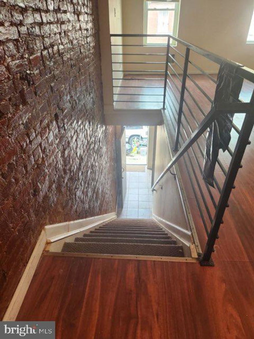 Currently set up as a duplex. Each unit 1 Bdrm/1 Bath $850 per month. Zoning is RM1. Will need zoning for duplex. Exposed brick wall, contemporary iron railing, hardwood floors, etc. Total rent $1700 month. Will need some notice because of tenants. 
*Can be purchased with single family home next door at 1822 E Madison* (rented at $1100 month)