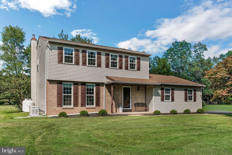 Welcome to this beautiful 3-bedroom, 1.5-bath colonial-style home, located in North Penn School District. Step inside to find gleaming hardwood floors that flow through the hallway, living room, and dining room, creating a warm and inviting atmosphere.  The heart of the home is the updated kitchen, featuring granite countertops, stunning cabinetry, a stylish new backsplash, and durable tile flooring. The kitchen opens seamlessly into an expanded family room—perfect for entertaining—complete with a cozy gas fireplace that adds both warmth and ambiance.  Upstairs, the hardwood floors continue into the hallway and one of the three roomy bedrooms. The primary bedroom includes a private makeup area with its own sink, offering added convenience and functionality.  A full bathroom serves all three bedrooms.  The unfinished basement offers ample storage space or future additional living space.  The laundry area is also located on this level.  A 1-car attached garage provides flexibility—use it for parking, storage, or convert it into an additional bedroom or office.  Plus, a large detached 2-car garage gives you even more room for vehicles, hobbies, or a workshop.  Situated on a nearly half-acre flat lot, the outdoor space is a true highlight. Enjoy relaxing or entertaining on the concrete patio.  The large backyard provides endless possibilities for gardening, play, or future enhancements.  This home offers space, style, and versatility—don’t miss your chance to make it yours!