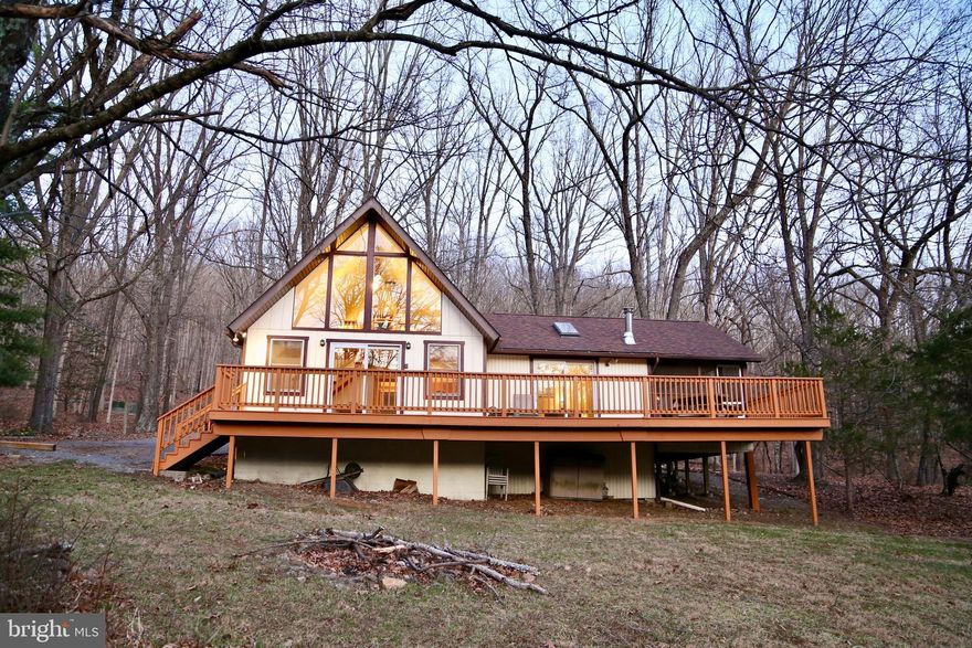 ✨RARE OPPORTUNITY✨Discover the perfect mountain retreat with this charming 2BR/1BA Chalet in the heart of Lost River Valley, priced to sell. This well-maintained mountain home offers a cozy main floor bedroom, a lofted second bedroom with stunning views, and an open living space with a wood-burning stove for warmth. Enjoy the peaceful outdoors with a screened-in porch, an open deck, and a backyard with a fire pit. 

Purchase this beautiful property for your own leisure, or take advantage of this TURN-KEY OPPORTUNITY and add it to your short-term rental portfolio.
 
Just minutes from the Guesthouse, you’ll have the perfect spot for socializing with neighbors and friends. Whether you're looking for a weekend getaway or a full-time mountain retreat, this chalet offers the ideal escape with all the modern comforts.