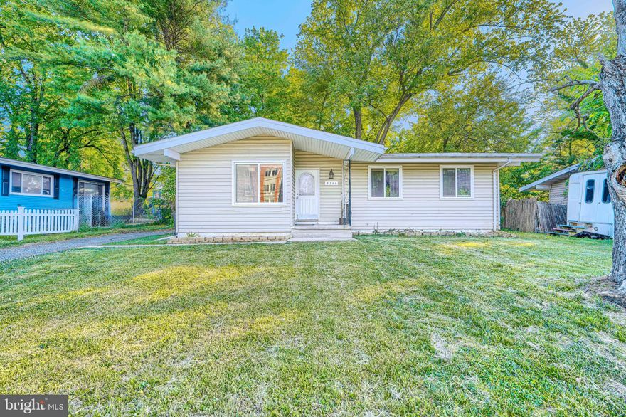 Discover the charm of this well-maintained raised ranch in the desirable Burmont neighborhood. Built in 1959, this home seamlessly blends classic design with modern comforts, offering a spacious 1,656 sq. ft. of finished living space. Step inside to find an inviting open floor plan adorned with hardwood and stylish laminate plank flooring. The heart of the home is the country-style kitchen, featuring a generous island and stainless-steel appliances, perfect for culinary enthusiasts. The dining area flows effortlessly into the living space, creating a warm and welcoming atmosphere. This residence features three convenient entry-level bedrooms, ideal for guests or multi-generational living. The two full bathrooms are thoughtfully designed, with relaxing tub shower combination. Venture downstairs to the fully finished basement, and you will find a spacious family room and an extra room offering versatile space that can be converted into a recreation room, an office or extra storage room. With both interior access and a walkout entrance, this space is as functional. Outside, enjoy the tranquility of your 0.21-acre lot, complete with a spacious deck perfect for summer barbecues or morning coffee. The property is enhanced by sidewalks and streetlights, ensuring a safe and pleasant environment. With off-street parking and a prime location, this home is a rare find that combines comfort, style, and convenience. Don't miss the opportunity to make it yours! Note - Some images in this listing have been virtually staged