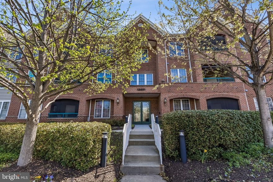 Welcome to Heritage Hunt – Northern Virginia’s Premier 55+ Active Adult  Golf and Country Club Community! This sought-after main-level corner unit 3 bedroom condo offers the perfect blend of comfort, convenience, and community living.  featuring  wood cabinets, a pantry cabinet, stainless steel appliances (including a gas stove, built-in microwave, dishwasher, and refrigerator), and a breakfast nook.  A convenient laundry closet comes equipped with stacked washer and dryer,  dining room that opens to a welcoming living room with a electric fireplace for those  chilly days, plus easy access to the covered porch—great for relaxing.  The primary suite offers, a walk-in closet, and a tiled  bath with a walk-in shower, single vanity, and tiled floor. The second corner bedroom features 2 bright windows,  w/ walk-in closet . A second full bath includes a single vanity and a tub/shower combination and third bedroom. Additional highlights include:  Hall coat closet for extra storage, Assigned covered garage parking plus open lot parking private Storage room that conveys with the unit, Building elevator for easy access to upper levels Condo fee covers water and trash pick-up, while the HOA fee provides access to an exceptional array of amenities—gym, indoor & outdoor pools, tennis courts, pickleball, bocce ball, walking trails, clubhouse events, and more. This spacious condo offers low-maintenance living in a vibrant, active-adult community.