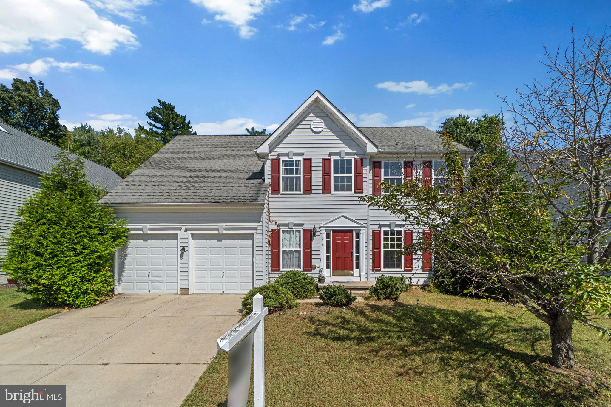 Stately Colonial single-family residence offering 2,672 square feet, 4 spacious bedrooms, 3 full bathrooms, 1 half bathroom, and a 2-car garage in desirable Ridge. Step inside the welcoming two-story foyer, where a convenient powder room sits just off the entry. The traditional layout includes a formal living room that seamlessly opens to a sun-drenched dining room, complete with an elegant chair railing and a charming bay window. The warm and inviting eat-in kitchen boasts an island with breakfast bar seating, sleek stainless steel appliances, a stylish backsplash, a walk-in pantry, and a cozy breakfast area with sliding glass doors that lead to the backyard. Just beyond, the spacious family room provides the perfect gathering spot with its comforting fireplace. A laundry room adds functionality to the main level. Upstairs, you’ll find four carpeted bedrooms and two full bathrooms, including the expansive primary suite. Vaulted ceilings elevate the space, while the luxurious en suite bath offers a soaking tub, separate shower, private water closet, and a dual-sink vanity. The walk-up lower level is designed for both relaxation and entertainment, featuring a generous recreation room with built-in bookcases, an alcove perfect for a TV or media setup, and a full bathroom. A large storage room completes this level, offering plenty of space for organization. Outdoors, the yard is backed by mature trees, fencing, and lush shrubbery, creating a private and serene retreat ideal for outdoor living.