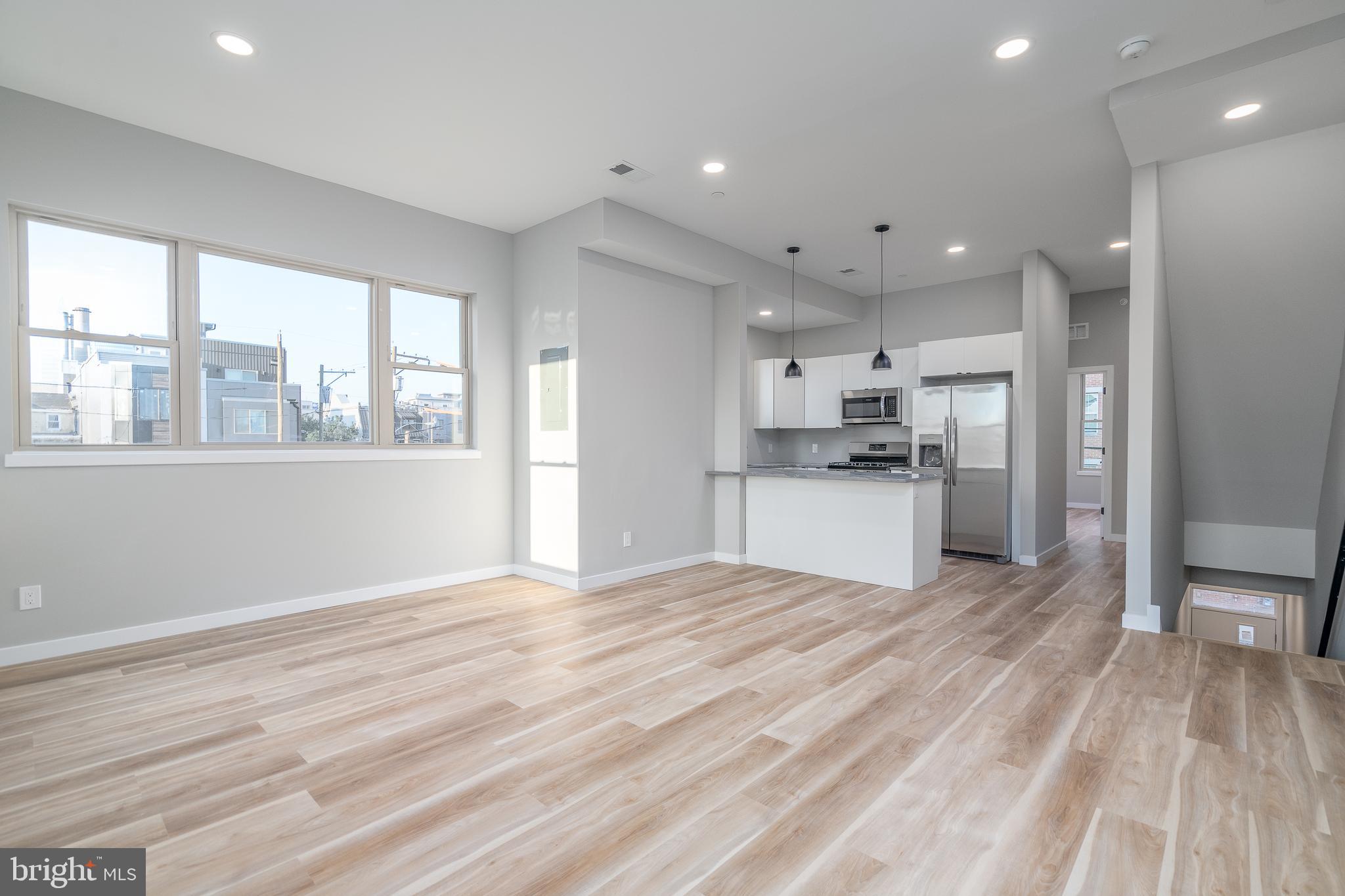 Welcome home to your brand new, corner penthouse apartment in Grays Ferry. Step inside and walk up to a wide open living space, flooded with natural light from every angle. There’s room for a dining table and still have the option to sit at the breakfast bar. The U-shaped kitchen is perfect for culinary enthusiasts, featuring a gas range with white shaker cabinets, stainless steel appliances, and granite countertops. With four bedrooms and three full bathrooms, this apartment offers 1600 square feet of living space. As you make your way to the roof deck, get ready to be mesmerized by the incredible city views that stretch across Center City, West Philly, and the stadiums. This space is perfect for hosting gatherings or simply unwinding after a long day. Additionally, a video doorbell ensures the utmost security and convenience. The washer and dryer is conveniently located within the unit, adding to the ease and convenience of everyday living. Don't miss out on the opportunity to call this beautiful apartment home. Just over a mile to the University of Penn, Rittenhouse, and East Passyunk Square. Come take a look before it’s too late!