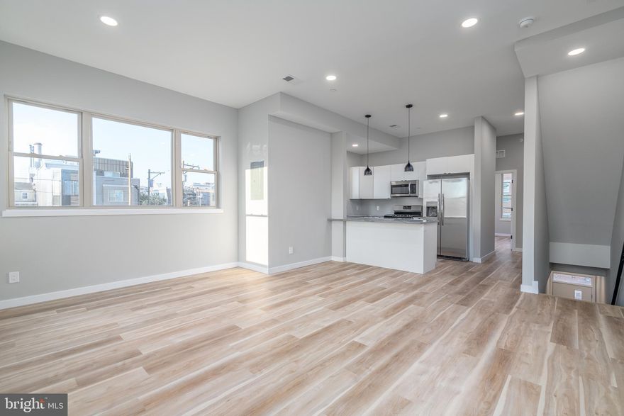 Welcome home to your brand new, corner penthouse apartment in Grays Ferry. Step inside and walk up to a wide open living space, flooded with natural light from every angle. There’s room for a dining table and still have the option to sit at the breakfast bar. The U-shaped kitchen is perfect for culinary enthusiasts, featuring a gas range with white shaker cabinets, stainless steel appliances, and granite countertops. With four bedrooms and three full bathrooms, this apartment offers 1600 square feet of living space. As you make your way to the roof deck, get ready to be mesmerized by the incredible city views that stretch across Center City, West Philly, and the stadiums. This space is perfect for hosting gatherings or simply unwinding after a long day.  Additionally, a video doorbell ensures the utmost security and convenience. The washer and dryer is conveniently located within the unit, adding to the ease and convenience of everyday living. Don't miss out on the opportunity to call this beautiful apartment home. Just over a mile to the University of Penn, Rittenhouse, and East Passyunk Square. Come take a look before it’s too late!