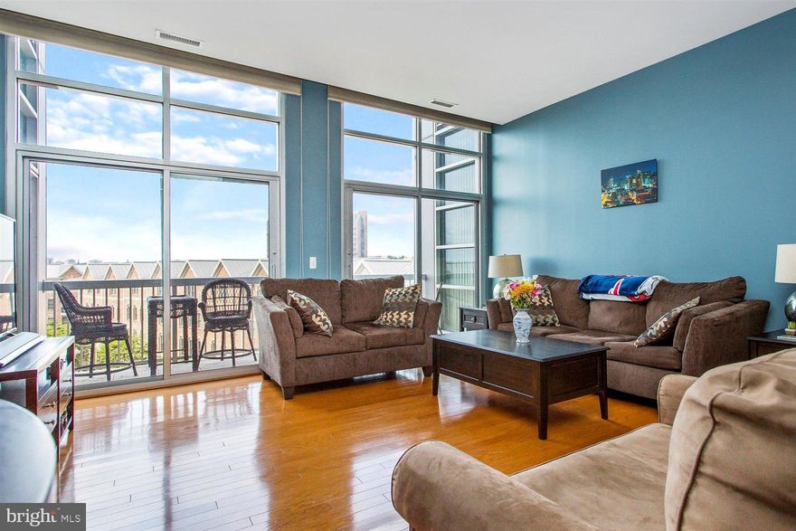 Gorgeous Light Filled Two Bedroom, 2 Bathroom Condo   In WaterFront Building In the Heart Of Canton! Striking Open Floor Plan With Stainless Steel Appliances, Kitchen Island With Breakfast Bar, Hardwood Floors, & Floor To Ceiling Windows & Natural Light Filled Living Room.  The Main Level Also Offers Den/Office, A Spacious Master Suite With 2 Walk In Closets, Jacuzzi Tub, & Separate Stand-Up Shower. Second Bedroom Offers A Walk- In Closet & Additional Full Bathroom.  Bonus Features Include Two Parking Spaces In Garage.