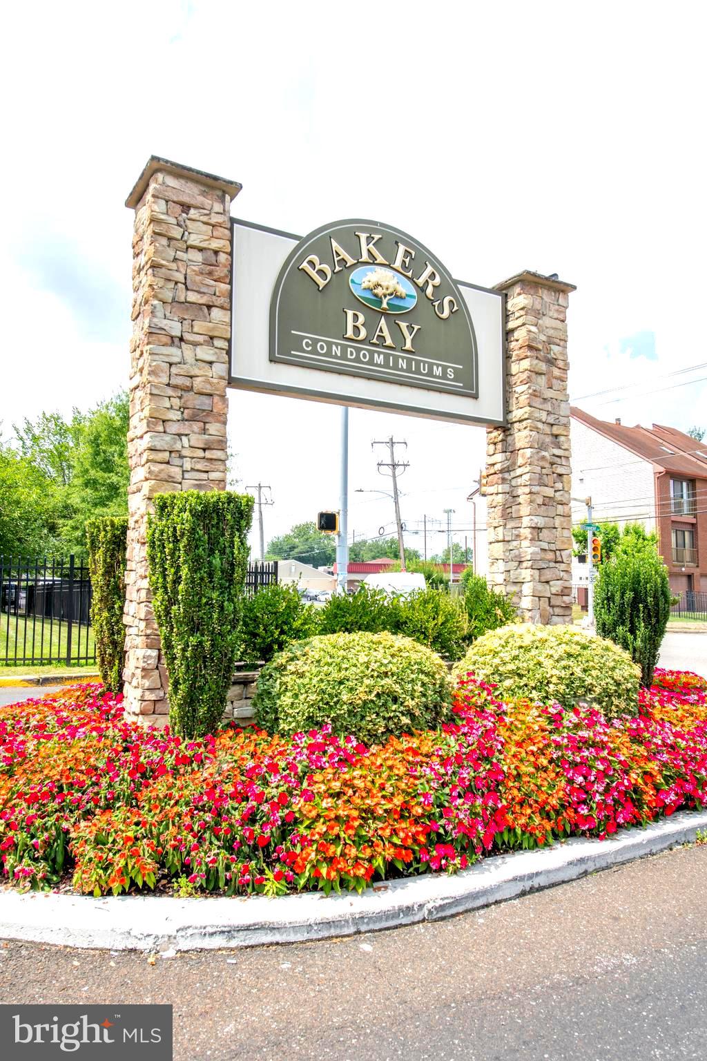 Welcome to this charming 1 bedroom 1 & 1/2 bath plus den/office first floor condo in the lovely Garden section in the gated community of Baker's Bay. Enter via a foyer with slate floor, storage and coat closet. The modern black & white kitchen has white cabinets, black counter tops, gas stove, built-in microwave oven and a glass block breakfast bar with pendant lights and seating. The kitchen is open to the dining room with hardwood look laminate floor and sliding glass doors to a delightful, tranquil, covered patio where you can relax and enjoy the outdoors. The patio is also right off the parking lot that makes it so convenient to unload your groceries. The spacious living room has 2 huge windows that provide an abundance of natural light and includes an attractive electric fireplace. There is also a den/office area that has access to the patio. The owners suite is very spacious and includes 2 walk-in closets and an attached full bathroom with tub/shower and a separate vanity/dressing area and laundry closet. There is a convenient powder room off the hallway near the front door. Additional features: community amenities include 24 hr manned gatehouse entrance; 2 heated pools (indoor/outdoor), hot tub, sauna rooms, 2 tennis courts, library, commons area with observation deck overlooking the Delaware River, card room, ping pong, billiards and a fitness center. The condo fee includes :water/sewer, trash pick up 3 times a week, snow removal, Comcast cable with 1cable box & building insurance. Convenient location close to restaurants, shopping, and public transportation. This is stress free living at its's best! Make your appointment today!