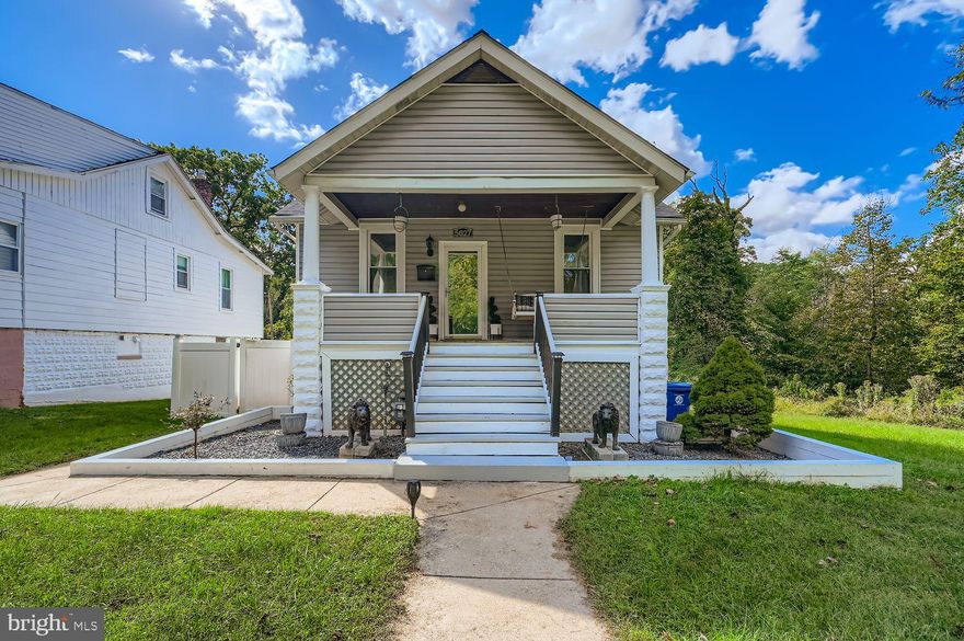 Tucked away on a desirable corner lot in the heart of Gwynn Oak, you'll find this lovely property at 5627 Wayne Ave. Enjoy serene views of greenery and the convenience of being just moments from the main thoroughfare, offering easy access to restaurants, shops, and the highway.
As you approach, the front porch offers a welcoming entry with ample space for chairs, perfect for enjoying your morning coffee or evening breeze. The main level of this home boasts a thoughtful layout featuring two comfortable bedrooms and one full bathroom with tile flooring. The living room/dining room combination is highlighted by beautiful hardwood floors, elegant crown molding, and flows seamlessly into the updated kitchen. The kitchen is equipped with stainless steel appliances, tile flooring, and attractive decorative laminate countertops and backsplash. From the kitchen, step into the spacious enclosed sunroom—a perfect spot for relaxing or entertaining! Also located on the main level is a convenient pull-down staircase providing access to the attic, which offers fantastic potential to be converted into a fully finished space, and where new insulation was installed in 2025.
Enjoy peace of mind with recent upgrades, including new house siding (2021), a new roof installed on the main house (2021) and a new roof on the sunroom (2019). The home's comfort is secured with a new air conditioning unit also replaced in 2021.
The partially finished basement, accessed from the kitchen, adds versatility to the property. This space includes two finished bonus rooms and a full bathroom. One of the bonus rooms provides access directly to the fenced yard! The rest of the basement is an unfinished space ideal for storage and laundry.  The rear yard has 2 sheds that can accommodate your gardening tools and other supplies and a wire fence.
With on-street parking and a secluded location, this home offers a wonderful blend of character, convenience, and opportunity. Don't miss the chance to make this Gwynn Oak gem your own!