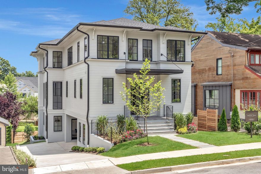 Griffin Head and TTR Sotheby's International Realty are pleased to present this sophisticated new construction custom home in a prime Lyon Park location. This elegant home is gracefully set on a quiet street that backs to a private neighborhood park, but is a short walk to Clarendon metro and attractions. Features include over 5,500 sq. ft, 5 beds, 5 baths, beautiful windows and design to maximize light and park views, soaring ceilings, exquisite finishes, a gourmet kitchen with Miehle appliances and breakfast area, multiple home office and/or home gym options, two gas fireplaces, an attached oversized garage and a spacious above ground lower level that opens to a large terrace and fenced yard  leading to the park. Griffin Head's renowned artistry is evident throughout with unique architectural details. Griffin Head takes great pride that every one of their North Arlington homes is unique, a reflection of the varied and special lives of its occupants.