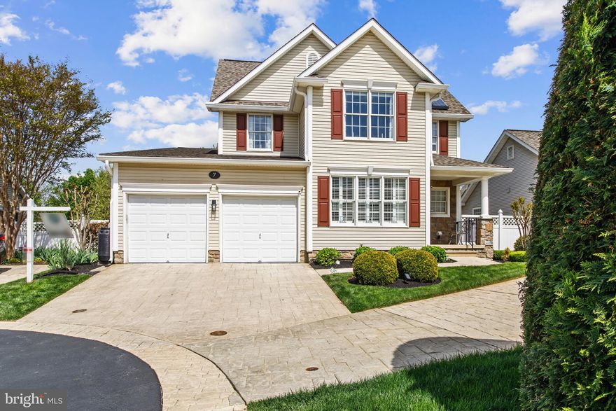 OPEN HOUSE SATURDAY 4/25 - 1:00-3:00! Welcome to 7 Derr Lane in the sought-after Villages at Foxfield—Middletown’s premier 55+ community—where Original Owners have meticulously maintained and thoughtfully upgraded this beautiful home, showcasing true pride of ownership everywhere you look. Perfectly positioned within walking distance to Middletown Park and its many amenities, this home also backs to serene woods, walking/jogging paths, and open green space—offering both convenience and some privacy. Enjoy peaceful mornings on the covered front porch or unwind in the backyard retreat featuring a walkout patio, koi pond, and a hidden “secret garden” be sure not to miss. Inside, the home blends comfort and modern updates. The kitchen is a standout with a Corian island, mosaic tile backsplash, stainless steel appliances (replaced 2019), induction downdraft cooktop, double oven, and ceramic flooring—ideal for both everyday living and entertaining. The main level boasts hardwood flooring (2018) and a warm, inviting family room with a propane fireplace and direct access to the newer, enlarged Trex deck (2022, with updated door in 2025). The spacious layout includes vaulted ceilings, a tray ceiling in the primary suite, and a dramatic two-story overlook with loft above. The primary bath was beautifully renovated in 2017, and the upper level features new carpet (2019). Additional updates include leased solar panels for energy efficiency (2018), washer and dryer (2021), vinyl fencing (2022), new roof and ventilation (2024), HVAC (2015), and water heater (2018). The unfinished lower level offers a walkout to the backyard, rough-in for a full bath, and a wide-open layout ready to be customized to your needs. Garage is equipped with a 200 amp 240 volt EV charging circuit and a newer garage door opener (2021). This is a rare opportunity to own a truly move-in-ready home in Middletown’s most desirable active adult communities—combining thoughtful upgrades, natural beauty, and a vibrant lifestyle.