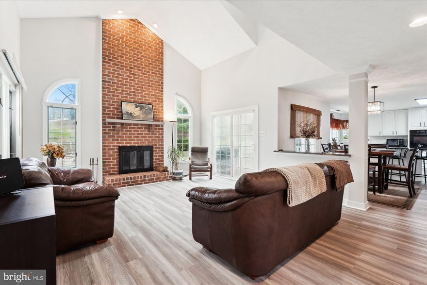 Located on a cul de sac lot in the much loved Piney Orchard community with its numerous walking paths, pools and playgrounds. Freshly painted  and new luxury vinyl plank throughout including the updated kitchen with granite counters, stainless steel appliances and induction cooktop.  Kitchen opens to 2 story great room with wood burning fireplace and exits to the rear deck. Upper level has generous sized 5 bedrooms and 2 full baths. Primary bedroom suite with vaulted ceiling, sitting area and extra storage closets and walk-in closet.  50 yr roof is about 10 years old,  Furnace 2yrs, A/C 8. The full unfinished basement with exit to the rear is ready for you to finish with a lifetime warranty from Value Dry. Owners have loved this super sized home waiting for you to love too. Don't miss out on this incredible opportunity again!***