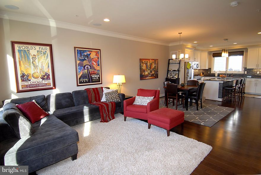 South facing 4 level townhome! Brazilian hardwood flooring & other upgrades throughout including main & upper levels living area & bedroom. Study - entry level. Gorgeous kitchen, granite counters,  beautiful backsplash, ss appliances with center island & deck. Rooftop deck w/ fireplace & Old Town Views,  2 car garage, walk to metro, TJ's, Harris Teeter, Metro. Owner's pix 2014