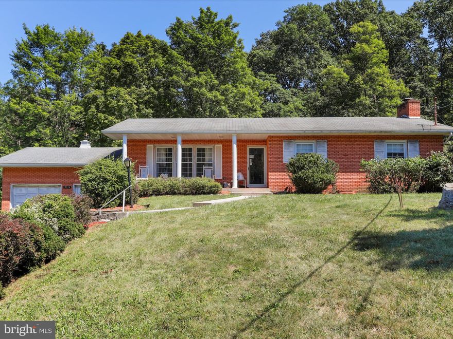 Discover comfort and space in this well-maintained 3 bedroom, 2 bath raised ranch offering over 2,000 sq ft of living space on a peaceful 0.92 acre lot. The main level features beautiful hardwood floors, a spacious living room with a cozy wood-burning fireplace, and a country-style eat-in kitchen with plenty of cabinetry and natural light. Enjoy a traditional layout with a dedicated dining area, three generously sized bedrooms, and a partially finished lower level that includes a large rec room and second full bath perfect for guests, hobbies, or a home office. Outside, mature landscaping, a private wooded backdrop, and a 2 car garage create the perfect balance of privacy and convenience all just minutes from downtown Frostburg and I-68. This home offers a peaceful setting, functional space, and timeless charm ready for its next owner.