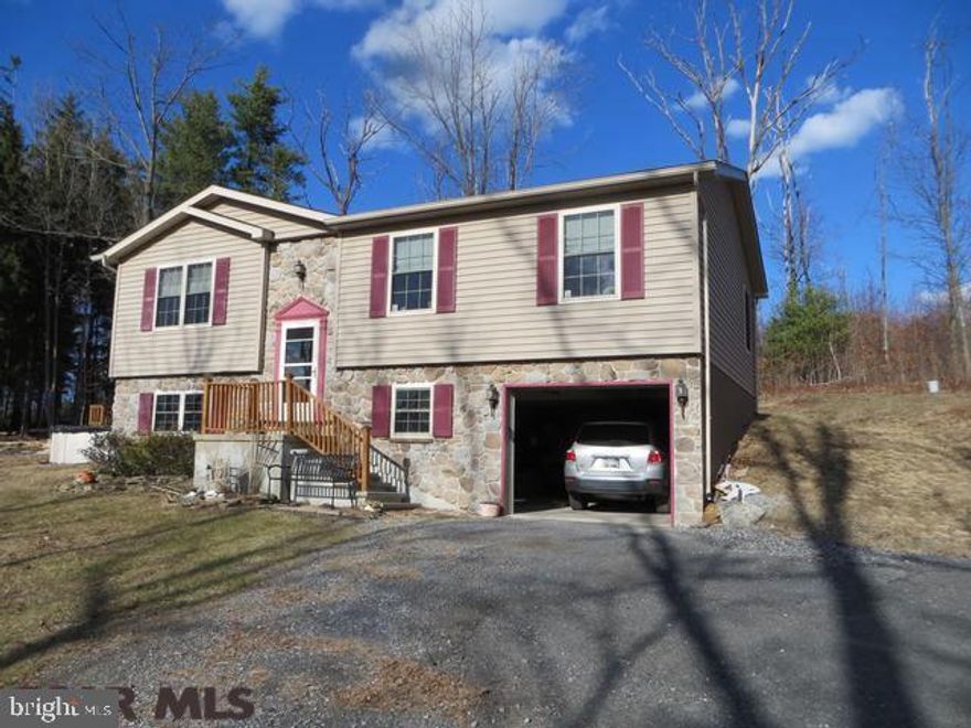Enjoy country living on a 1.2 acre lot with above ground pool and fantastic deck for entertaining & watching wildlife. Light & bright living room and open kitchen/dining area with plenty of cabinets & pantry. Master bedroom bath has walk-in shower. Lower level has space to finish another room, laundry area, plenty of storage & is pre-plumbed for additional bathroom. Enjoy this home all summer with central air & all winter with the efficient heat pump.
