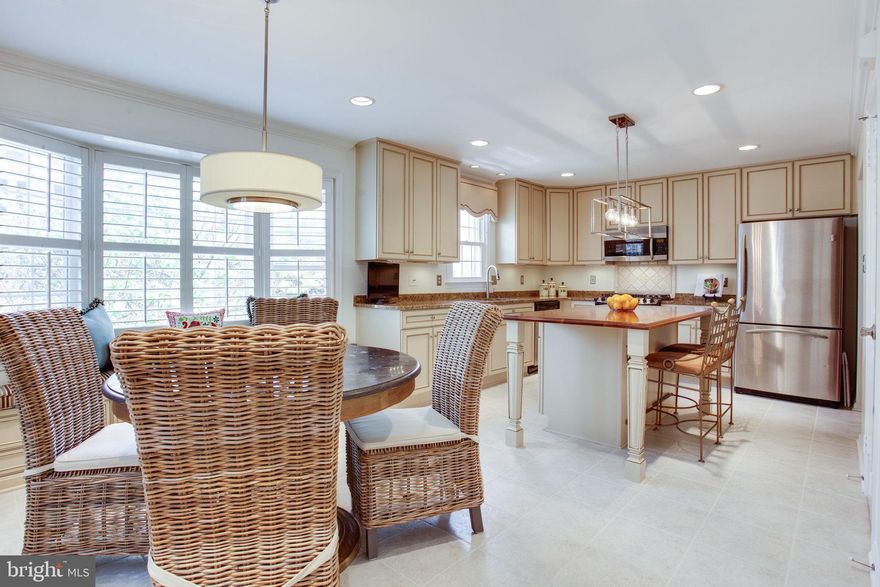 Awesome light-filled, large end unit Townhome. 4th bedroom on upper level! Renovated kitchen! Custom Nickel finish Elfa Shelving in every single closet and pantry AND in garage! Pulley bike storage in garage. Pull down attic stairs to COMPLETELY floored Attic floor with lights, new attic fan and high ceilings! 90 Jet Hot Tub with new motors! NEW Roof! Fresh Paint! Brazilian Cherry Hardwoods on Bedroom Level and Main Level except Kitchen! Plantation Shutters! Many more updates! Photos being taken soon and will be uploaded.