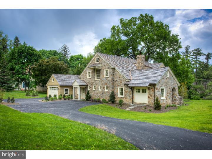 This fully renovated, authentic 1911 stone carriage house was originally built to serve Bolingbroke mansion in Radnor Township. It sits in one of the Main Line's most desirable neighborhoods and is accessible to transportation, schools and the shops and restaurants of downtown Wayne. The home was designed by architect Ann Ledger as a personal residence and every effort was made to preserve and enhance the authentic character of the original building. All interior walls, finishes, windows and doors were removed leaving only the original stone walls, roof framing and floor framing. A new cedar roof with copper flashing and beveled cedar siding were added. Much of the exterior detail was restored and used as the example for all that was added. Custom millwork, handmade hardware, light fixtures and cabinetry were locally sourced. The interior layout was completely redesigned and all new framing, insulation and mechanical systems were installed. White oak quarter sawn floors run throughout the house. The entire first floor and all bathrooms have radiant heated floors. The Great Room/Kitchen occupies the original carriage bay and features a new masonry wood burning fireplace with a wood paneled mantel, a flagstone hearth and Pennsylvania black slate surround. The open kitchen has custom cabinetry with an island featuring an inlaid wood counter. Top of the line appliances include a Wolf cook top, SubZero Refrigerator, Bosch dishwasher and Kitchen Aid double ovens. New French Doors at the original carriage entrance lead to a flagstone covered porch from the Great Room. The study has custom bookshelves, outside access to original arched side porch and refurbished "angel" fountain. The powder room has glazed walls, granite topped vanity and a hidden tiled shower behind a sliding barn door. The home is elevator ready for a two-stop car. From the two car garage you enter into a mudroom area with a decorative utility sink, large closet area with shelving and access to a work room/potting shed with access to the backyard through large double doors. The second floor has a master bedroom with 2 walk-in closets and a bath with a footed tub, granite topped vanity and subway tiled shower. There are two additional bedrooms, a hall bath, laundry room, many large closet areas and a cozy attic studio room. The attention to history is only enhanced by the modern, highly efficient systems for today's comfortable living.