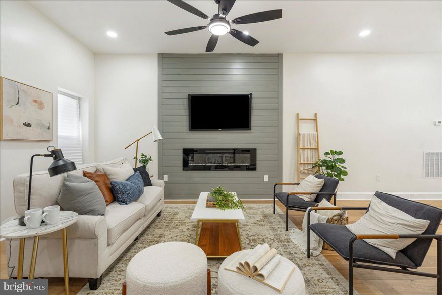 Welcome to 3400 Woodbrook Ave, a fully renovated 5-bedroom, 4.5-bath brick townhouse offering over 3,000 square feet of luxurious living space across four finished levels in the heart of Baltimore’s historic Greater Mondawmin neighborhood. This stunning 1920s home has been completely modernized in 2025 with a bright open-concept main level, a chef’s kitchen featuring granite countertops and stainless steel appliances, and four beautifully updated full baths. Highlights include a newly waterproofed basement with flexible living or guest space, a brand-new rear deck ideal for entertaining, and a detached two-car garage with additional rear parking. With new HVAC, central air, recessed lighting, and refinished hardwood floors throughout, this move-in ready home combines timeless charm with contemporary convenience. Located just minutes from Druid Hill Park, the Mondawmin Metro, and local shops, this is an exceptional opportunity to own a turnkey home in a vibrant urban community.