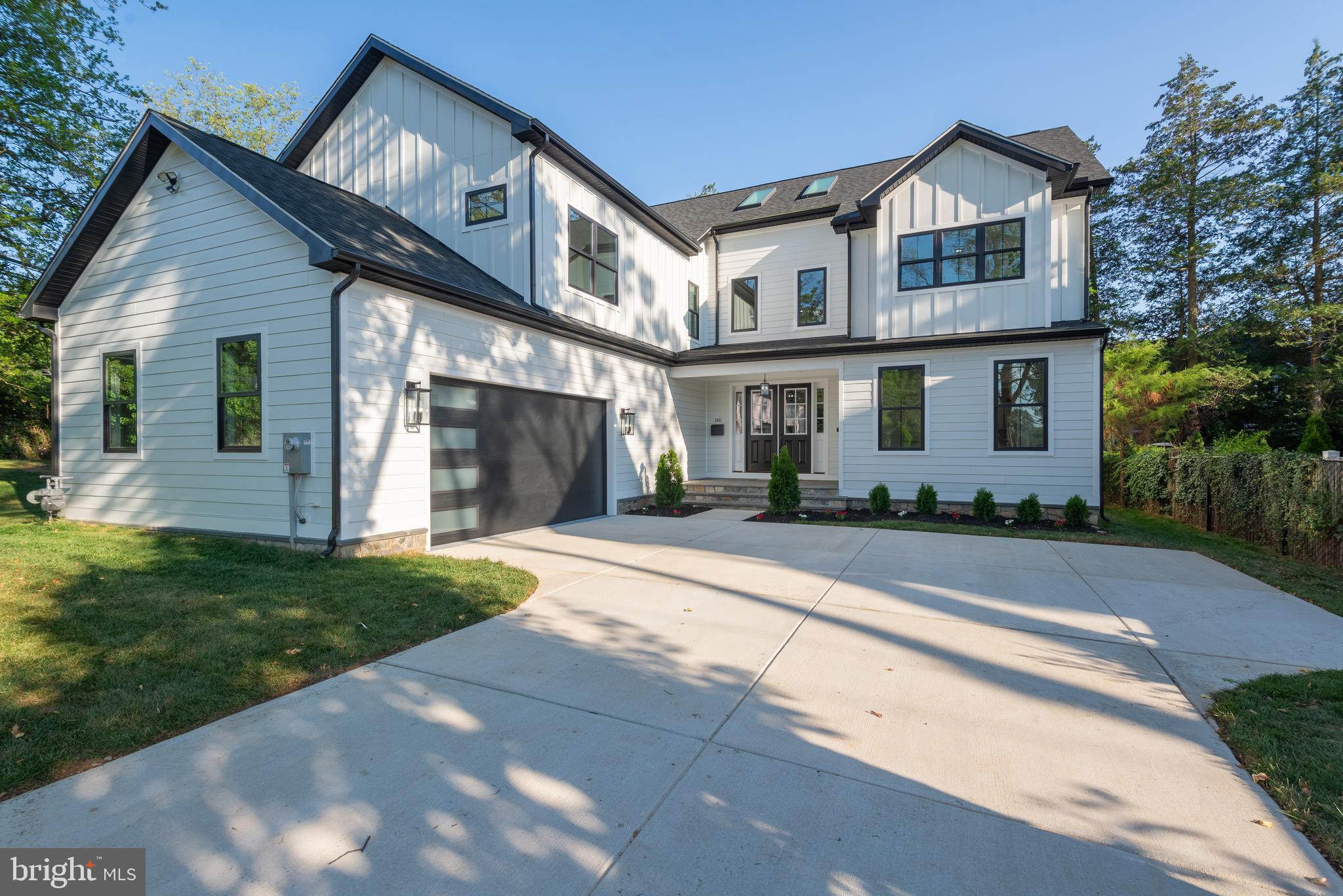 Enjoy this stunning six-bedroom, five-bathroom new build home with over 6,200 square feet of living space on three fully finished levels. This beautiful home features a courtyard driveway and a two-car garage. The two-story foyer welcomes you with natural light from two overhead skylights, highlighting a striking modern staircase.
Enjoy high end finishes throughout with coffered and decorative ceilings, as well as a gourmet kitchen with stainless steel appliances, including a wine cooler and butler’s pantry. The kitchen island overlooks a beautiful window filled breakfast nook, a great room with a gas fireplace and an oversized patio door. A flagstone screened in porch with a gas fireplace seamlessly extends your living space outside.
Upstairs is home to an oversized owner's bedroom with a sitting area, two large walk-in closets, and a spa like en-suite bathroom with a stand-up shower and a stand-alone bath tub and two large vanities. The second level is also home to three additional bedrooms, with two more full bathrooms – one of which is a buddy bath ensuring every bedroom has access to a bathroom. A convenient second story laundry makes this home functional.
This brand new home has hardwood floors on the first and second levels, and waterproof LVP in the finished basement. The fully finished basement has a large recreation room with a bar, another full bedroom and bathroom and a potential future movie theater room.
The home is situated in a prime location in the Alta Vista neighborhood with the Walter Johnson/Wyngate School cluster near NIH, Walter Reed, Montgomery Mall and the Wildwood Shopping Center.