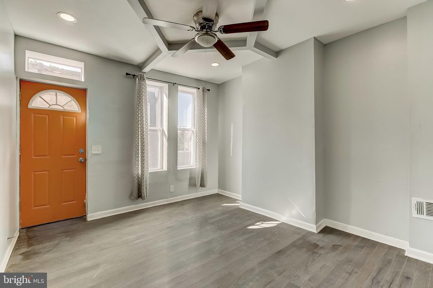 Welcome home to this recently renovated 2 bedroom townhome in East Baltimore. This home features 1 full bathroom, new hardwood floors, vaulted ceilings, granite countertops, stainless steel appliances, updated light fixtures, new ceiling fans, recessed lighting, spacious bedrooms, new carpet, exposed brick throughout, newer windows, a clean unfinished basement, a fenced-in patio and more! Located within close proximity to both Johns Hopkins Hospital North. and Collington Square Park, with easy access to major traffic and E Chase St.