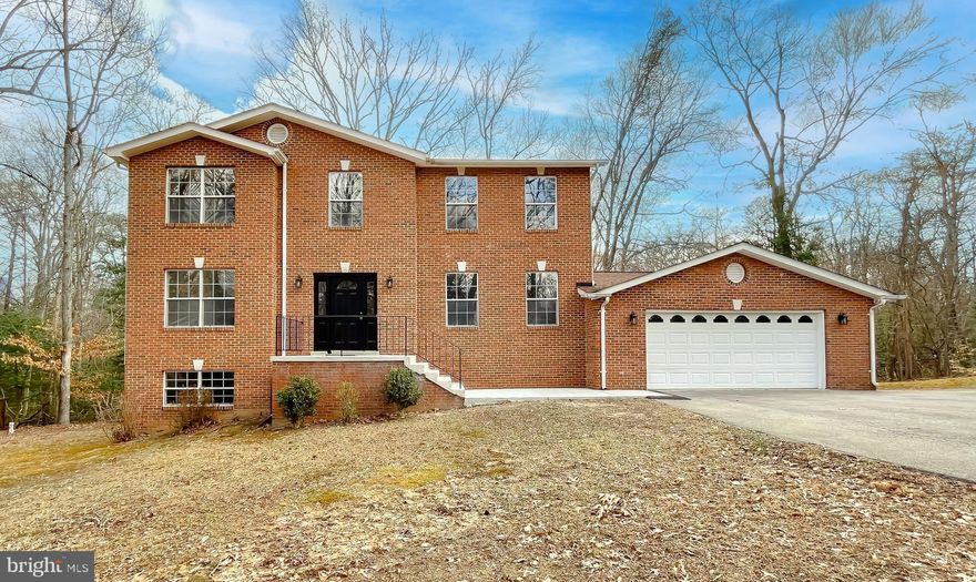 This classic 3-bedroom, 2.5-bath brick colonial sits on a half-acre lot surrounded by trees, offering privacy and tranquility. With only one owner, this well-maintained home features all-new flooring and fresh paint throughout, making it truly move-in ready. Enjoy the outdoors watching the birds fly or deer run on the rear deck. Take advantage of plenty of parking, and appreciate the convenience of a 2-car attached garage. The unfinished basement provides endless potential for storage or future expansion. Washer and dryer convey for added ease. Nestled in a water-oriented community, you’ll have easy access to local parks, boat ramps, and the waterfront dining experience at Vera’s Restaurant. Located just minutes to all of what Solomons Island has to offer! Great location for the daily commuter to The Patuxent River Naval Air Station or Washington, D.C. Don’t miss your opportunity to call this one HOME! Schedule your showing today!