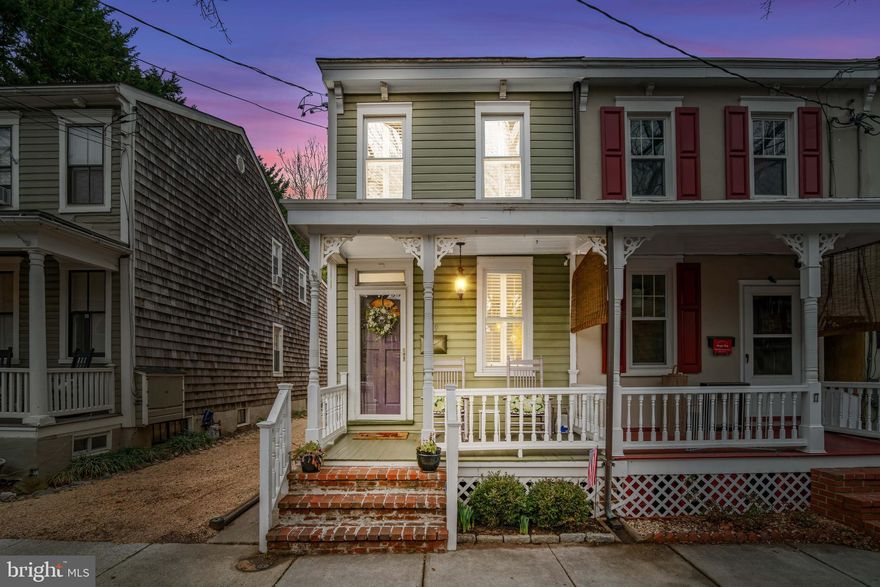 Discover the allure of historic Annapolis living in this captivating 2-bedroom, 1.5-bath home located in the desirable Murray Hill community. This home offers a seamless fusion of historic charm and modern upgrades. The heart of the home is the renovated kitchen, complete with custom cabinetry, granite countertops, and a gorgeous backsplash. The washer and dryer are conveniently located in the main living area. Beautiful hardwood floors can be found throughout the home. Enjoy the expansive backyard patio, set against a backdrop of exquisite landscaping.  The backyard flower garden boasts a variety of blooms including hydrangeas, peonies, phlox, tulips, hyacinths, lilacs, lilies, daisies, daylilies, coneflowers, and roses - not a single spot overlooked, resembling something from a magazine. The garden is stunning, throughout the year. Being an end unit, there are numerous advantages - easy access to the home and seamless transition between the backyard and indoors. Additional highlights include a spacious basement for abundant storage and a very spacious shed. Enjoy serene evenings on the inviting, cozy front porch or take a stroll to Main Street and West Street within a short distance. This charming home is situated in the heart of Annapolis, offering easy access to the city’s vibrant restaurants and art galleries. Enjoy the convenience of being close to major commuting routes such as I-97, US-50, and MD-32. Nestled in the highly sought-after Murray Hill, this residence provides a perfect location just steps away from Downtown Annapolis. Discover exquisite dining options, the prestigious Naval Academy, scenic views of the Chesapeake Bay, and diverse shopping experiences. The neighborhood boasts wide streets lined with majestic trees and provides access to Spa Creek for a tranquil waterfront setting. You are bound to fall in love with this exceptional home!