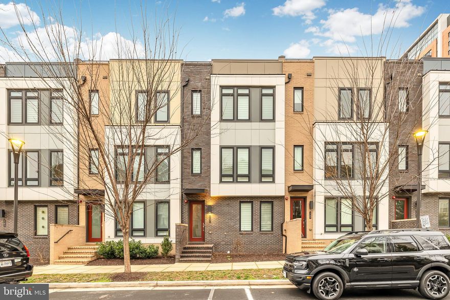 **Price Reduced to $5,200! Exceptional Townhome Available for Rent!** Welcome to Eisenhower Square, where luxury living meets convenience in the heart of Alexandria. From the moment you arrive, it's evident that this isn't just a place to live – it's a lifestyle.  Step into luxury with this stunning, almost never-lived-in townhome, now available at an incredible price!

Lower Level with Flex Space:  Let's begin our tour on the lower level, where you're greeted by a versatile flex space that can easily transform into your ideal home office, gym, or creative sanctuary. With access to a convenient half bath and a spacious double garage, this level seamlessly combines functionality with comfort.

Main Level Living:  This floor boasts a spacious and open layout, perfect for both relaxing and entertaining with 10-foot ceilings. First up, we have the chef's gourmet center kitchen, complete with a pantry room for all your storage needs. The kitchen features beautiful hardwood flooring, luxurious quartz countertops, and a stunning backsplash that adds a touch of elegance. The island with large pendant lights is not only stylish but also functional, providing seating for four bar stools and making entertaining a breeze! The dining area, illuminated by a captivating chandelier that's sure to grab your guests' attention. The family room it's the perfect spot to unwind and enjoy your favorite TV shows or sporting events. Ready for some fresh air, step out onto the private balcony with composite decking, ideal for evening chats or simply soaking up the sunshine. Whether you're working, studying, playing, or lounging, this home has got you covered. Half Bath and in-ceiling speakers with SONOS CONNECT AMP.

Upper Level:  Here, you'll find two spacious bedrooms, each with its own ensuite bathroom, offering privacy and comfort for everyone in the household. As you step inside, you'll notice a beautiful ceiling fan gently stirring the air, creating a comfortable atmosphere. Sunlight pours in through a wall of windows, filling the room with natural light and a substantial walk-in closet – plenty of space for all your clothing and accessories! The real showstopper is the primary bathroom, which rivals even the most luxurious hotel spa, it boasts double vanities with quartz countertops, beautiful tile from floor to ceiling, and a seamless glass shower door that adds a touch of sophistication, built-in shower seat, and enclosed toilet for privacy. 2nd bedroom it's equipped with its own ceiling fan for added comfort and features a full bathroom and a spacious walk-in closet – perfect for guests or family members. Washer and dryer in the hallway. 

Top Level Floor:  The very top floor is finished as the crown jewel of this home, you may never want to leave. No one will even know it is there if you don't tell! Penthouse style floor that has a stylish 3rd BR and adjacent BH. This level is all about entertainment and relaxation with state-of-the-art full surround sound speakers. Picture yourself hosting gatherings or simply escaping from the hustle and bustle of everyday life in this inviting loft area. And let's not forget about the wet bar with beverage fridge, which can easily transform into a coffee bar if that's more your style. The highlight of this floor is the rooftop terrace, accessible through glass sliding doors with upgraded tiles on the deck . Imagine sipping your morning coffee or hosting evening gatherings while surrounded by nature's splendor – it's truly a space where you can relax, unwind, and connect with the outdoors in comfort and style.

This beautiful home features: Gleaming hardwood floors throughout; Over $100k in upgrades, wireless access points for seamless connectivity, & recessed lighting in every room. Eisenhower Metro/Wegmans grocery  less than 1 mile and DCA Airport/DC just a short drive.  Indulge in culinary delights at Sweet Fire Donna's, Tequila Taco, Whiskey & Oyster, & Port City.  Contact us today for a tour.