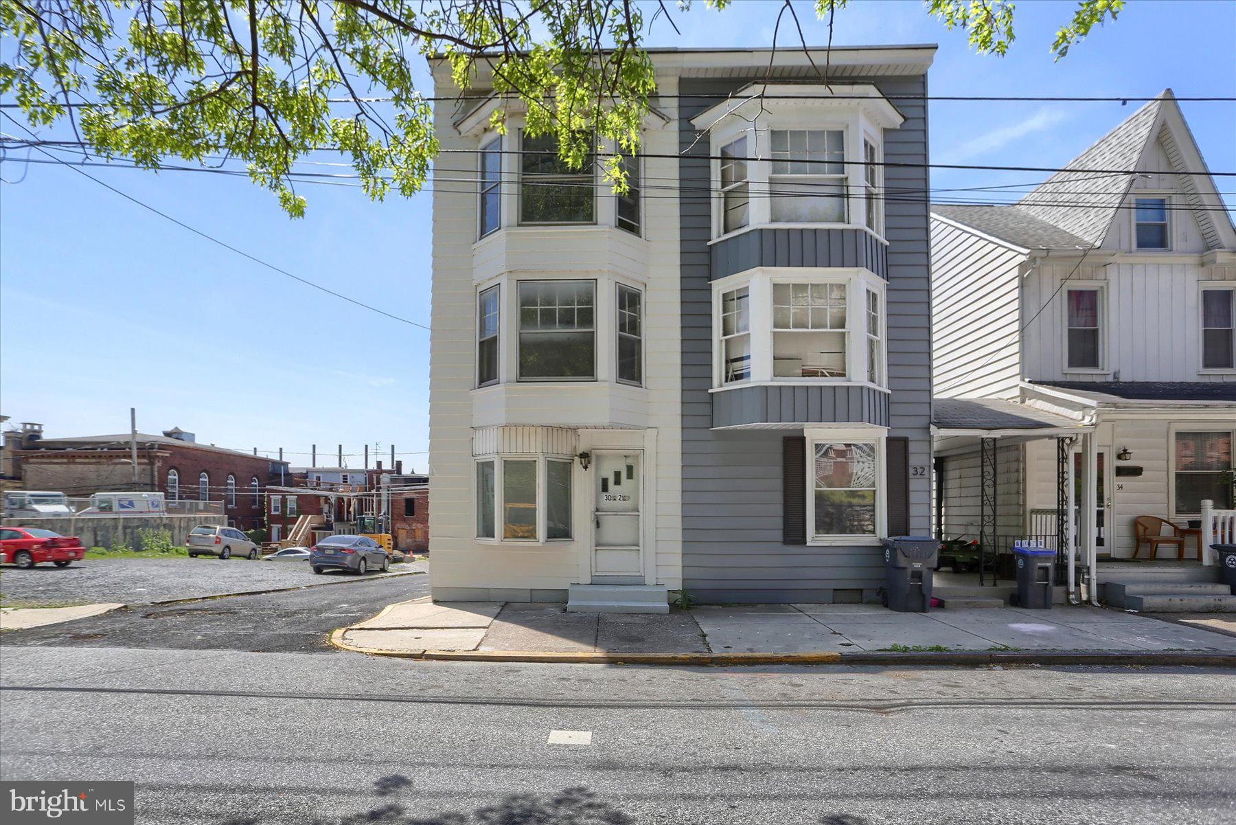 Cheaper than rent or become a landlord! Move in ready 4 bedrooms, 2 baths. New paint, new flooring, new kitchen. Two rear porches overlook fenced in yard.