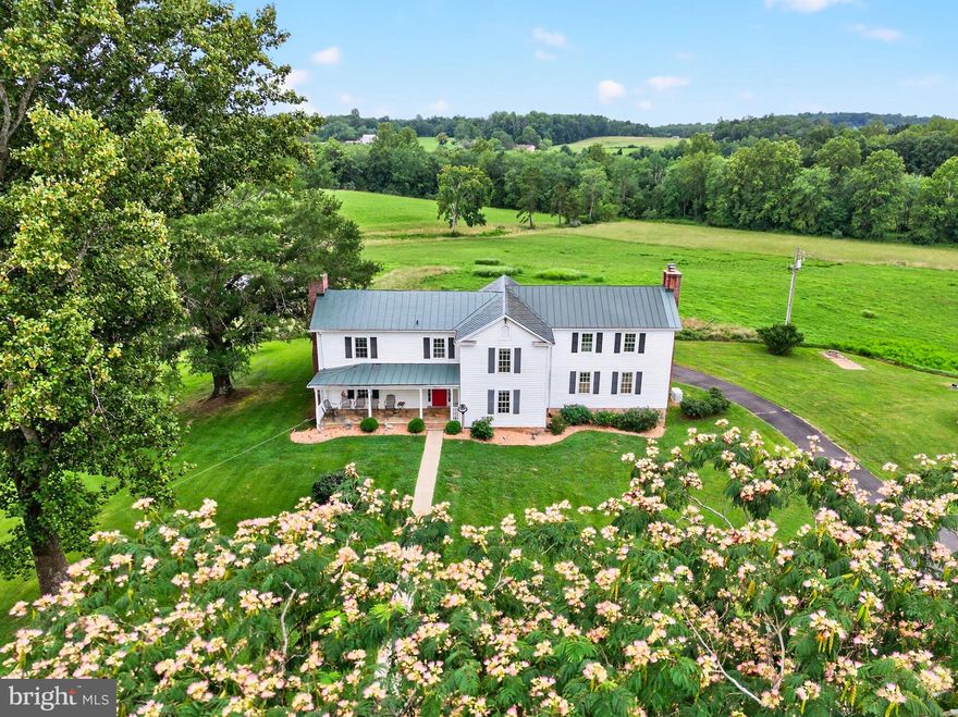 Happy Hill is an enchanting family farm that elegantly blends the past with the comforts of modern living. Set on over 57 picturesque acres the meticulously maintained 1880 Farmhouse evokes a storybook ambiance—rolling fields, tranquil pond views, and the enduring beauty of the Virginia countryside. With four spacious bedrooms—each thoughtfully designed with its own private bath—there is ample room to enjoy both privacy and comfort. The home’s gourmet kitchen seamlessly opens to a sunlit family room which was added in 2013. A luxurious master suite is conveniently located on the main level with views of the pond and fields The living room and family room both have fireplaces, and the large dining room can handle all your entertaining needs. A partial conditioned but unfinished basement is beneath the family room.  A charming one-bedroom guest cottage, complete with its own kitchen, living room, and full bathroom, is perfectly suited to hosting friends and family.  The six-stall barn boasts a spacious tack room, washer and dryer, and bathroom facilities. A large machine workroom is also part of the barn, offering abundant space for hobbies, repairs, or creative pursuits. Situated just 20 minutes from Warrenton and only 10 minutes from the quaint town of Washington, Virginia and outside of the Washington metropolitan area the property offers access to local amenities while providing a rural retreat. Perfect for a primary residence or a weekend home.