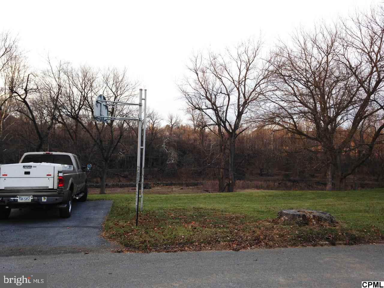 Beautiful lot in the Boro of Hummelstown. Bring your own builder while rates are low. The home site sits high but you can walk down to the creek to fish or boat. Quiet area in LD Schools. Community pool close-by. List agent is related to seller.