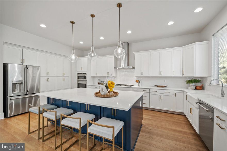 Where else can you find a 3-year-young home in North Arlington’s premier school district for under $1.8M? HERE!
Welcome to 2727 N George Mason Drive, a 3-year-young modern farmhouse offering over 5,000 sq. ft. of refined living space. This move-in-ready home features 5 bedrooms and 5.5 bathrooms across four spacious levels, blending thoughtful design with everyday convenience.

The covered front porch sets a warm welcome and timeless curb appeal. Inside, the main level features soaring 10-ft ceilings, a chef’s kitchen with upgraded appliances, a large center island and a walk-in pantry. The inviting family room offers a cozy gas fireplace flanked by custom built-in shelving, while a bright dining area and private office complete the open-concept design. A powder room is also located on this level.

Upstairs, the expansive primary suite impresses with a spa-like bathroom featuring double vanities and a large walk-in shower with both rain and standard fixtures. The suite also offers three closets for generous storage. Secondary bedrooms are equally well-appointed, each with its own en suite bath.

The top-level loft provides even more flexibility with a bedroom, full bath and a spacious laundry room offering ample room for storage, folding and hanging.

The finished walk-up basement includes a recreation room, an additional bedroom, a full bath, and abundant storage. A convenient side entrance from the driveway leads to a mudroom area with built-in cubbies and hanging space.

Additional highlights include dual-zone HVAC, two hot water heaters, a detached garage and desirable school district.

Ideally located just minutes from Tysons Corner, Washington, D.C., and major commuting routes, this home offers the perfect balance of luxury and convenience.