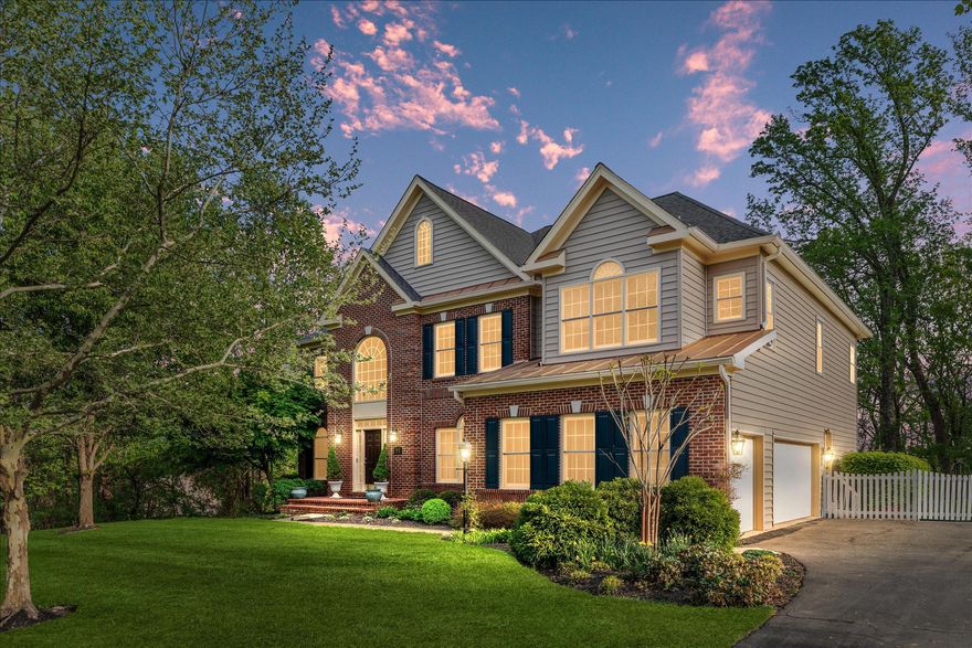 Tucked within one of Aldie's most established and desired neighborhoods, this brick-front home in The Marches sits on 1.27 private acres backing to woods and community open space, offering a sense of seclusion that feels increasingly rare in Loudoun County, without sacrificing convenience.

From the moment you arrive, the mature tree canopy, generous lot, and quiet surroundings signal that something special awaits. A two-story foyer welcomes you inside, where natural light and an effortless open flow carry you through a main level designed for the way people actually live. The formal dining room, framed by detailed moldings, connects seamlessly to the kitchen, while a private study and soaring two-story family room anchor the back of the home. Here, a floor-to-ceiling stone fireplace commands the room, with views extending beyond to the deck and the wooded yard that unfolds behind it.

The kitchen, fully renovated in 2025, is both beautiful and functional. Quartz countertops, double wall ovens, a built-in microwave, and a beverage fridge are anchored by a generous center island with seating - the kind of kitchen that handles a dinner party as effortlessly as a Tuesday morning. The adjoining breakfast room and sunroom open directly onto the expansive deck and fenced backyard, creating a natural flow between indoor gathering and outdoor living. A mudroom with drop zone and laundry area connects to the three-car side-load garage, which is also equipped with a dedicated EV charging outlet (240-volt, 50-amp).

Upstairs, the primary suite is a true sanctuary. A tray ceiling, sitting area, and two walk-in closets set the stage, while the 2026-renovated bathroom elevates the everyday with dual vanities, a spa-inspired walk-in shower, and finishes that feel anything but ordinary. A junior suite enjoys its own private bath, two additional bedrooms share a well-appointed Jack and Jill bathroom, and a fifth bedroom offers the flexibility every household eventually needs, whether that means a home office, nursery, or dedicated guest space.

The walk-out lower level is unfinished and full of possibility. With rough-in plumbing already in place for a full bath and direct access to the backyard and its wooded views, the foundation for a future rec room, home gym, or in-law suite is already set.

Major updates and investments to protect your home long-term include the roof replacement in 2021 and the two exterior HVAC units that were replaced in September 2016, accompanied by a new basement evaporator coil installed the same year. 

Beyond the property itself, the location delivers. Situated in Loudoun County with easy access to Dulles International Airport, Route 50, and Route 15, this home offers the quiet of countryside living without the compromise. Brambleton Town Center and the Village at Leesburg are just minutes away for shopping, dining, and everyday errands, while Hal and Berni Hanson Regional Park offers trails and open green space close to home. The wineries, farmers markets, and timeless charm of Middleburg and historic downtown Leesburg are all within easy reach - a lifestyle that is genuinely difficult to replicate at this price point in this county.

Thoughtfully updated, beautifully positioned, and ready for its next chapter - this is a home that invites you to slow down, settle in, and stay awhile.