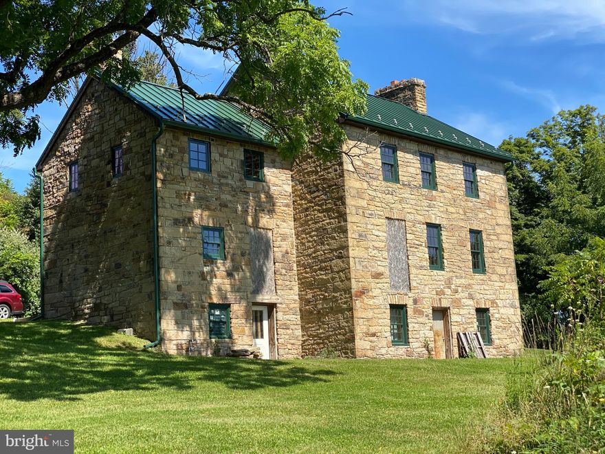 532 Acres 1826 Stone House partially remodeled, for a 3 bedroom  2 bath house Two Story 2992SF Re-pointed stone with Gas & Electric service Spring and Well for water .  Heat lines for radiant heated floors.   New Roof, Gutters & Windows. Hardwood Floors in living room.  5 Fireplaces with 3 Traditional and 2 Gas.  Airplane Hangar with a bathroom Well/Electric service  and above ground Fuel Tank for several planes and a grass runway public water 2 miles. This sits just  west of Midland, MD 4 miles from Frostburg State University campus