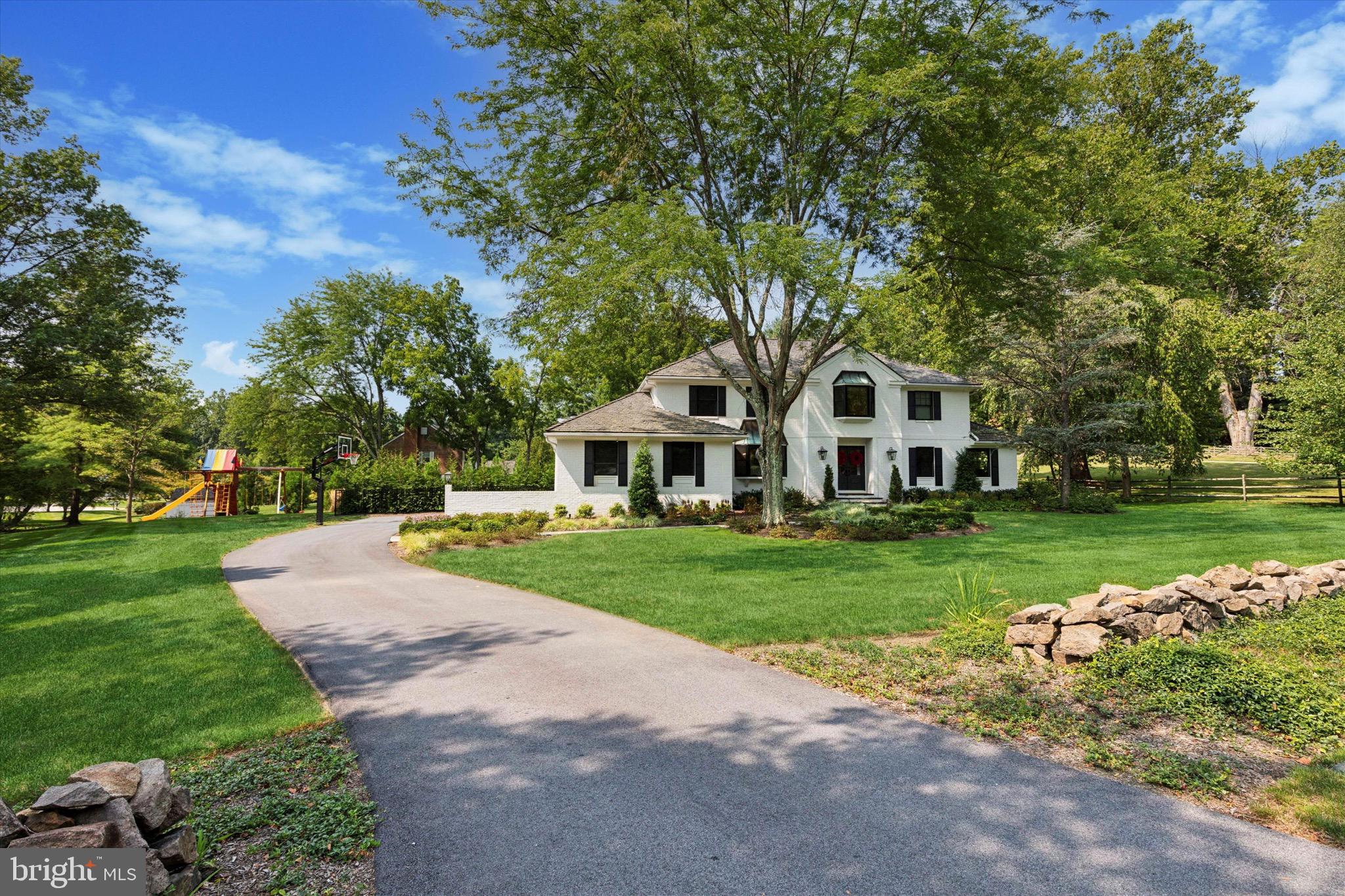 Welcome to 610 Dorset Road centrally located on the historic Main Line in Devon, PA. Just a short walk to the Devon Horse Show, and the Devon train station, this classic Center Hall colonial home went through an extensive top-to-bottom renovation in 2021 with first class amenities and finishes. Priced to sell, this turn-key home is the perfect opportunity for the next lucky Buyer to purchase a rarely offered move-in ready home on the Main Line. Located just 25 minutes from the Philadelphia Airport, or a train commute for working professionals commuting to New York or D.C., the location offers some of the most prestigious public & independent schools, as well as some of the best golf courses, on the East Coast.
This is a must see home before it is sold, with too many amenities to list. Starting with the warm and welcoming exterior, and modern floorplan and finishes, 610 Dorset offers fun and easy living in a home that is turn-key for the next owner. The sellers plan to transition the house with a full list of preferred vendors that are already familiar with caring for the home: from your landscaping/mowing/yard, to your pool, HVAC and A/V companies that installed everything in 2021.
Enter into a Foyer that provides an abundance of natural light and a dramatic two story ceiling, large chandelier and an elegantly curved stairway. A cozy den/music room is to the right of the foyer with Double doors that open to a Home Office, wired and perfectly situated for working remotely. The office is generous in size, and is framed by a large picture-frame window overlooking a peaceful and lovely manicured side yard. To the left of the Foyer is the formal Dining Room that offers plenty of space for entertaining both small and large gatherings.
Connected to the Foyer and Dining Room is the entrance to the Gourmet kitchen. Here you will find Custom wood cabinetry, Quartz countertops, Thermador appliances, including a Professional 6 burner plus griddle, gas and convection oven, and an island with a built-in ice-maker and plenty of prep space. Flowing seamlessly from the large kitchen, past the breakfast area, is a sun filled Family room with a wood burning fireplace. Off this lovely space, enjoy the ultimate in outdoor living through the double doors that walk onto a stunning covered-deck with a vaulted ceiling, a second gas fireplace, remote controlled built-in screens that can rise or fall at your control. Four built-in heaters are a light switch away for heating those chilly nights throughout the winter, and a view of those Chester County westerly sunsets. Offset of the deck is your outdoor kitchen boasting a built-in Gas fired grill, a wood-pellet Smoker, beverage refrigerator and a Beer Tap. The deck has an exit to the in-ground Salt Water pool with gorgeous landscaping for extra privacy. The pool was built with simplicity and functionality in mind. Constructed with a year-round spa, prolonged use of the pool itself can be from early Spring to Late fall, as the built in heater is easily controlled from the use of your mobile app. A fantastic space extending the living area with a fun and open vibe.Heading back inside up to the second floor is the Primary Bedroom with an accent wall, flowing into a large walk-in closet that enters to the Primary bath. The luxurious Bathroom offers a stall shower and soaking tub. There are Three additional bedrooms on this floor. The lower level of this home offers even more fun space with a Full Bar with seating at the counter, a sink, a 2-tap kegerator, beverage fridge and cabinet storage. Within a few steps is your 450 bottle wine cellar with floor to ceiling glass doors, and custom lighting. On the opposite side of the room is your 11ft projection screen theater area, perfect for movie nights and video games. Additionally on this level is an exercise/play room and a powder room.