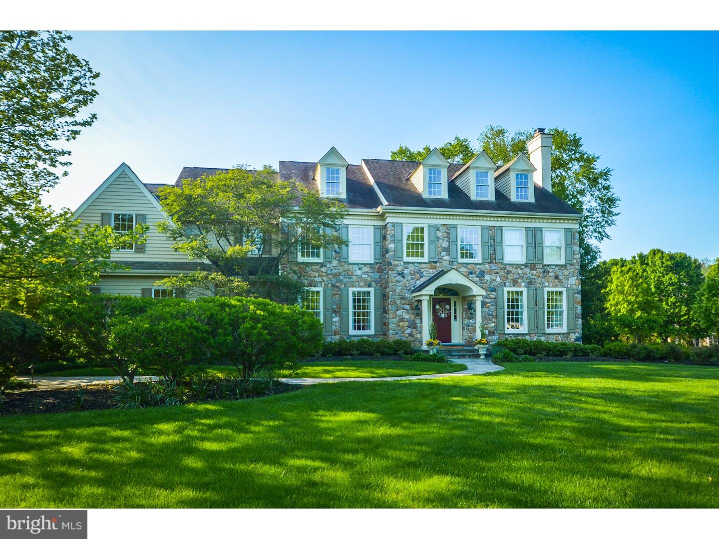 Enjoy living in one of the most prestigious neighborhoods in Lower Gwynedd. This beautifully appointed stone front custom Guidi built home is an enduring traditional classic. Set the stage for a grand entrance in this spaciously appointed foyer with beautiful staircase that leads to sophisticated living areas. A lot of livability in over 7,000 sq. ft. 5 Bedrooms, 4 full and 3 1/2 Baths. Spacious Dining Room, Formal Living Room with Fireplace. The large Great Room with raised hearth stone fireplace will be the center of entertaining in style. Experience the joy of cooking in this fully equipped kitchen featuring cathedral ceiling with skylights, granite counter-tops double ovens, gas range, microwave, large center island and loads of pantry space. Breakfast room off the the kitchen provides views of the sun drenched sunroom that leads to a backyard flagstone patio. Main Bedroom suite is enhanced by en-suite with soaking tub, double vanities, and room sized walk-in closets. Finished 3rd floor level with full bath doubles as a 5th bedroom or fantastic play-room. Lower level, Entertainment and media room in the dramatic, family sized recreation room with full sized wet bar & stacked stone fireplace. Work out in your private exercise room. Other amenities include: custom millwork and bead board t/o, central vacuum, stereo surround sound, hardwood floors, upgraded carpets, new garage doors. Situated on approximately 1 acre of meticulously groomed yard and patio this Enduring Classic is a statement of the Pride of Ownership.